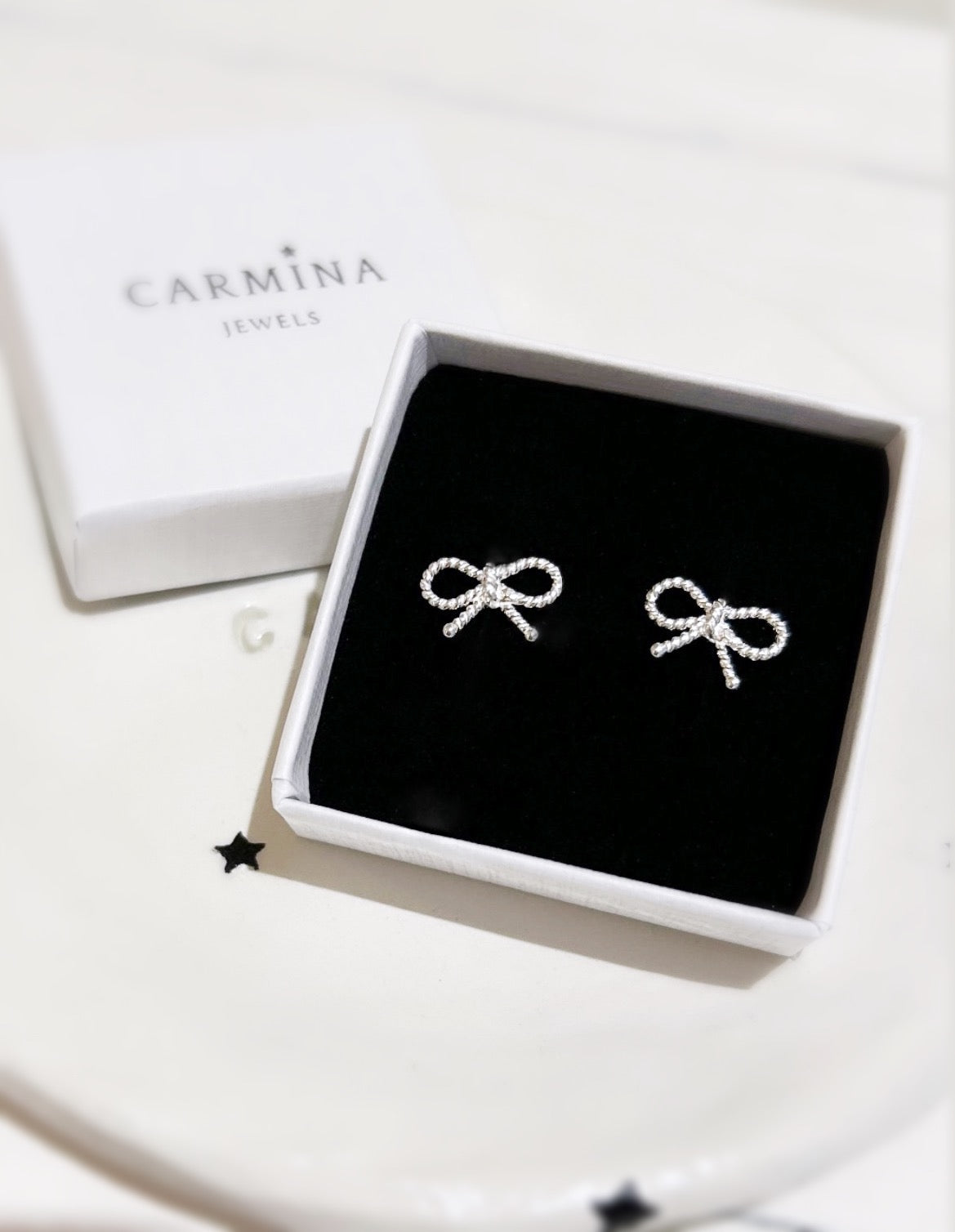 Silver bow stud earrings