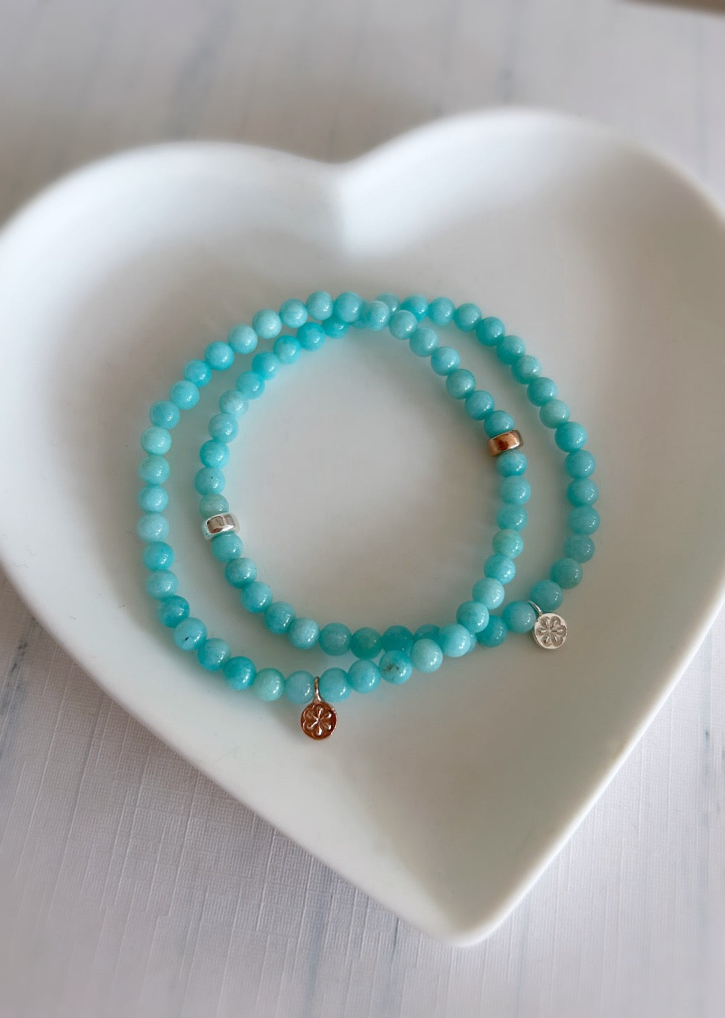 pretty semi precious beaded Amazonite stacking bracelet with a dainty daisy charm in a choice of either a Sterling Silver or Rose Gold Vermeil finish hand threaded on a stretch cord