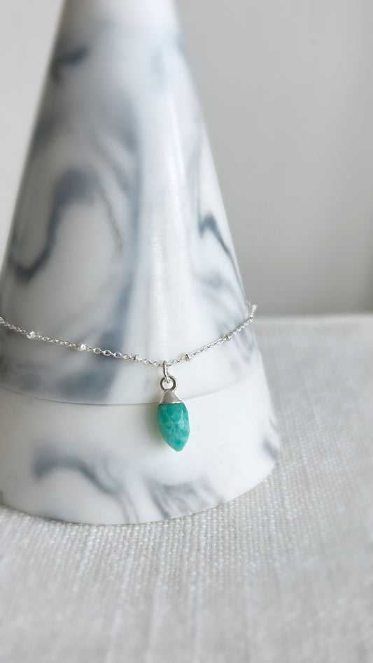 A beautiful sparkly Silver satellite chain bracelet with a semi precious Amazonite marquise droplet charm. 
