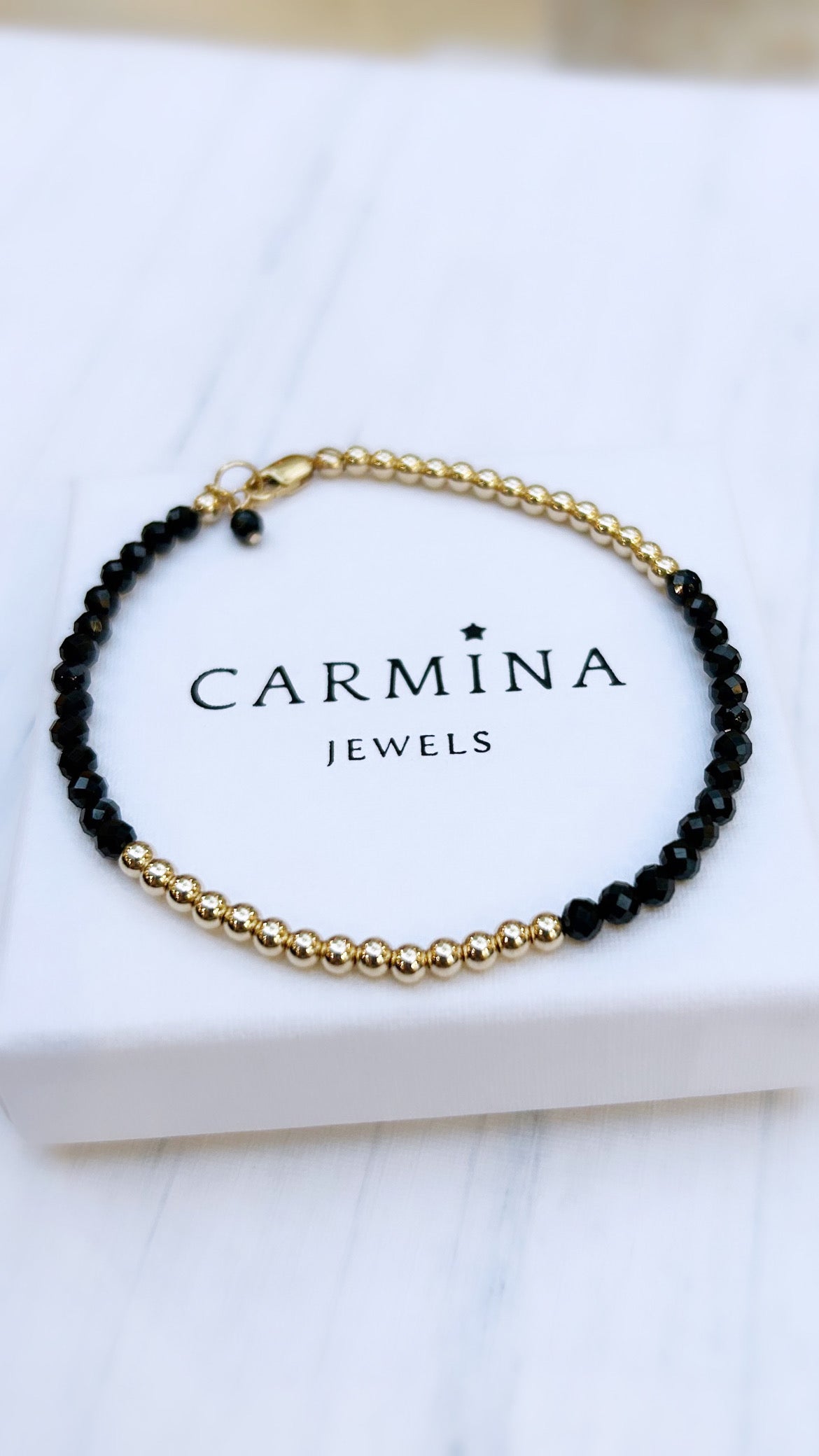 A Black Spinel faceted crystal bead bracelet with Sterling Silver or Gold Filled spacer beads