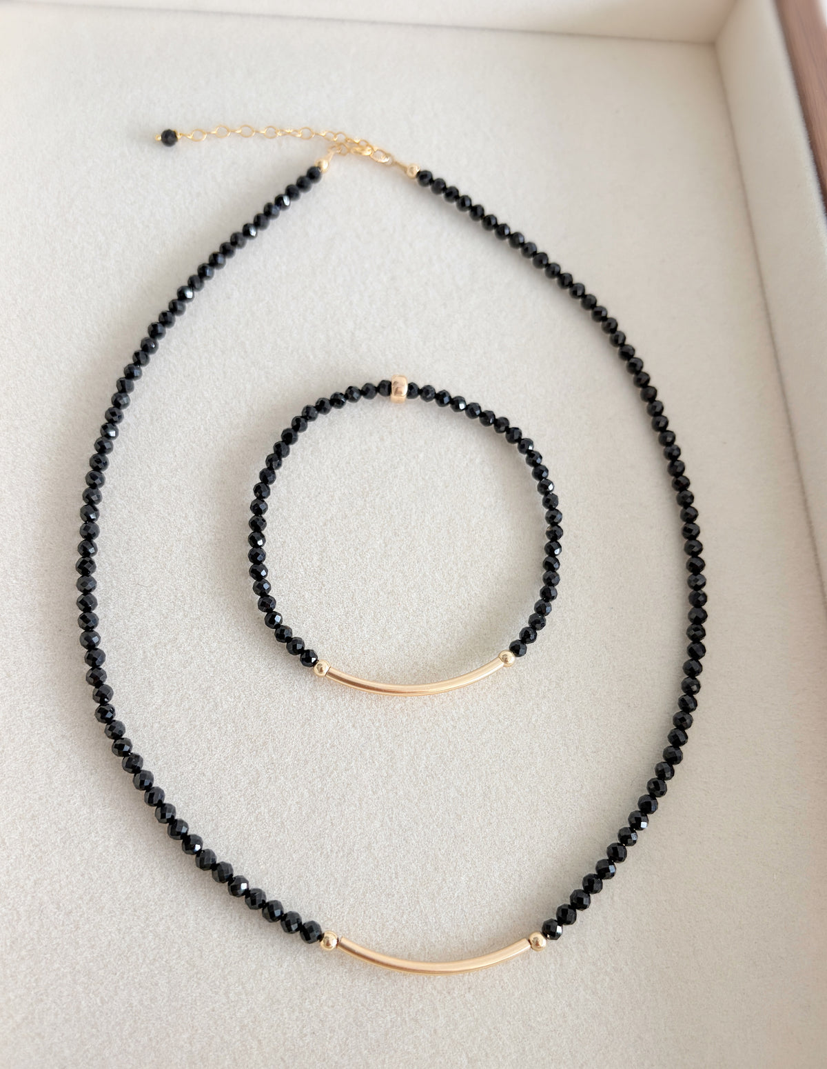 Stunning semi precious Black Spinel faceted bead necklace. This delicate necklace comes in a choice of two finishes using either Sterling Silver or Gold Filled accents.