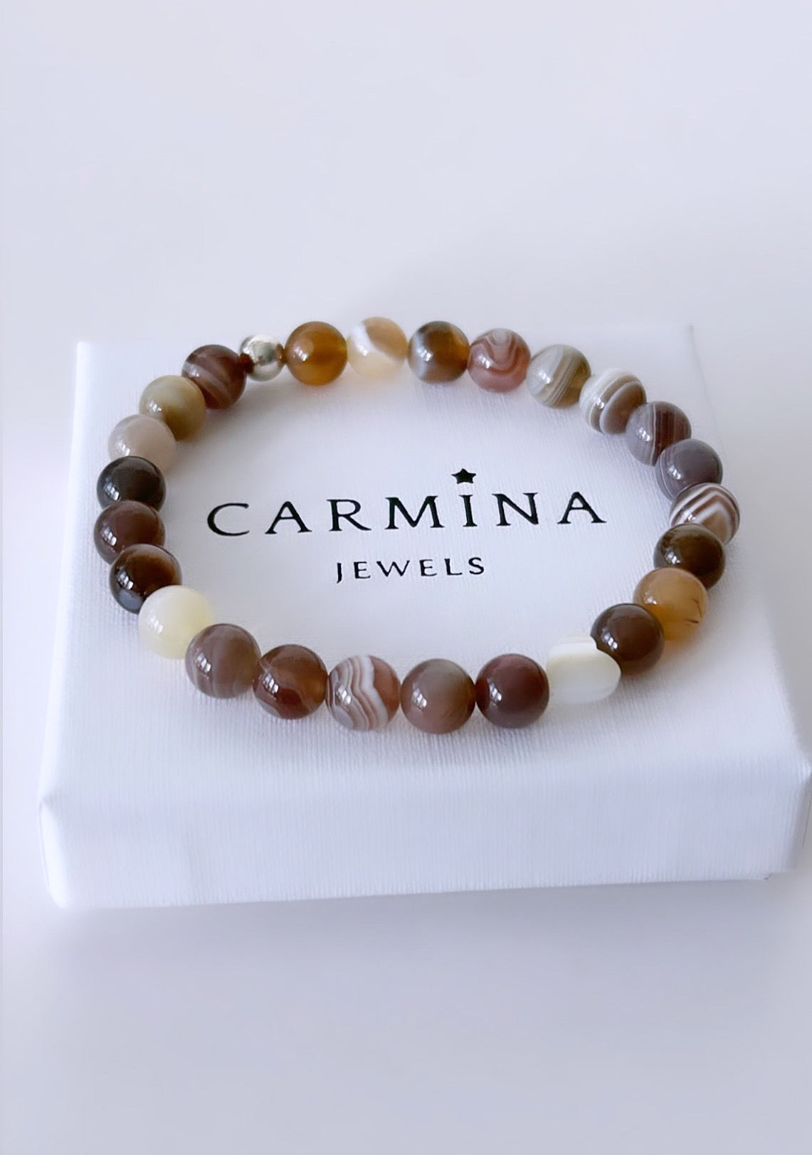 A gorgeous Semi precious beaded Botswana Agate bracelet on a stretch cord with mother of pearl. 
The Bracelet is available with a Sterling Silver or Gold Filled spacer bead and with either a Mother of Pearl heart or star bead