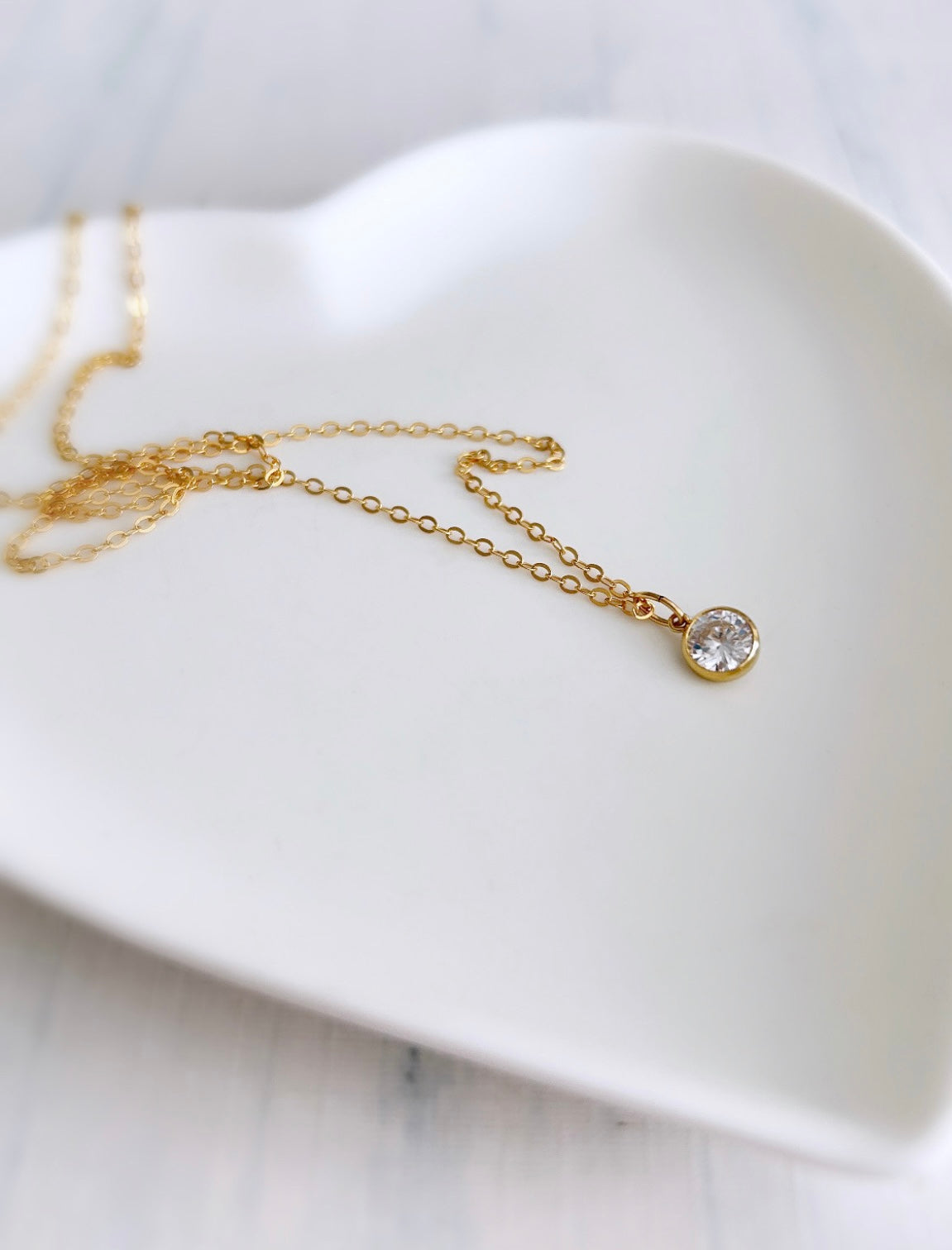 A beautiful crystal gemstone necklace - a gorgeous sparkly Cubic Zirconia charm on a delicate cable chain.
