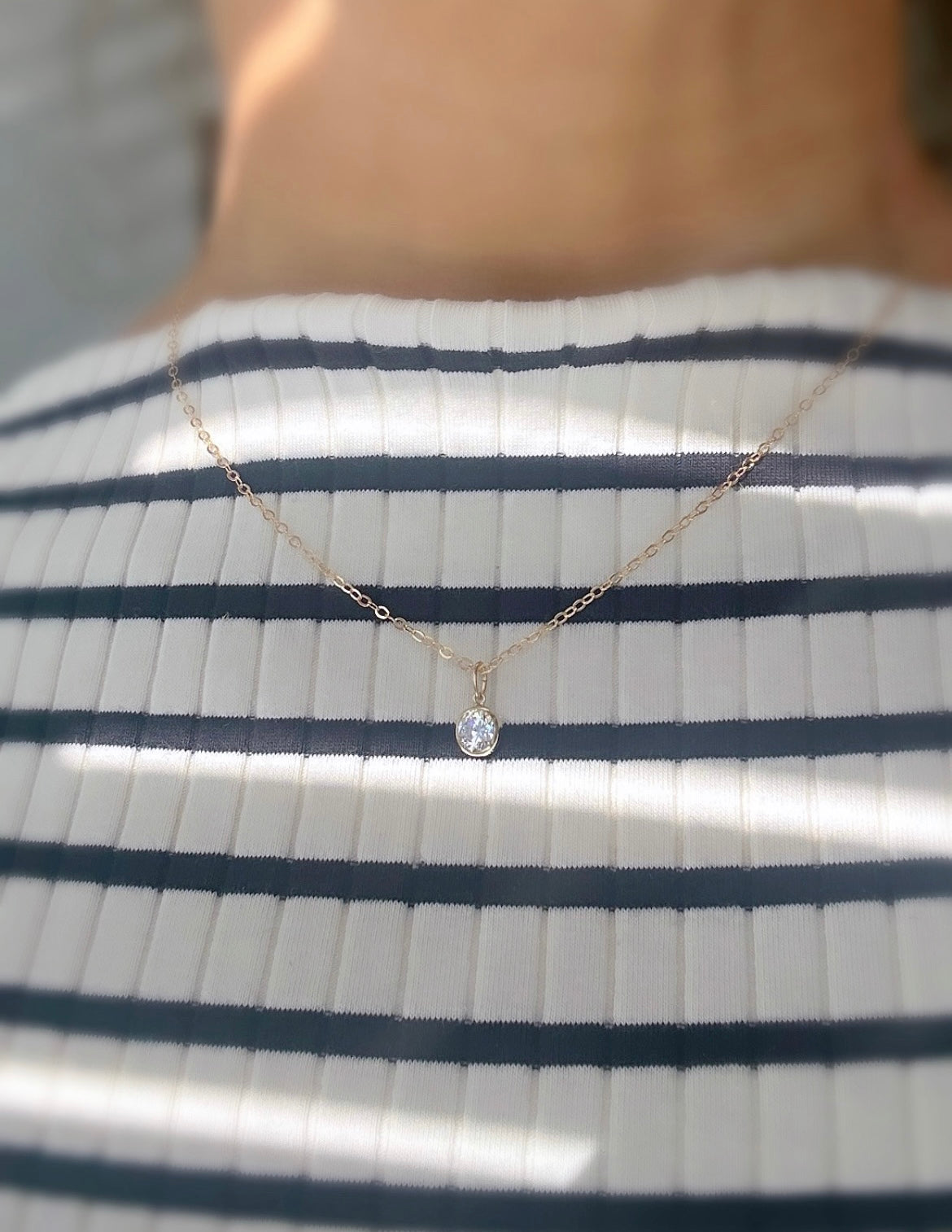 A beautiful crystal gemstone necklace - a gorgeous sparkly Cubic Zirconia charm on a delicate cable chain.
