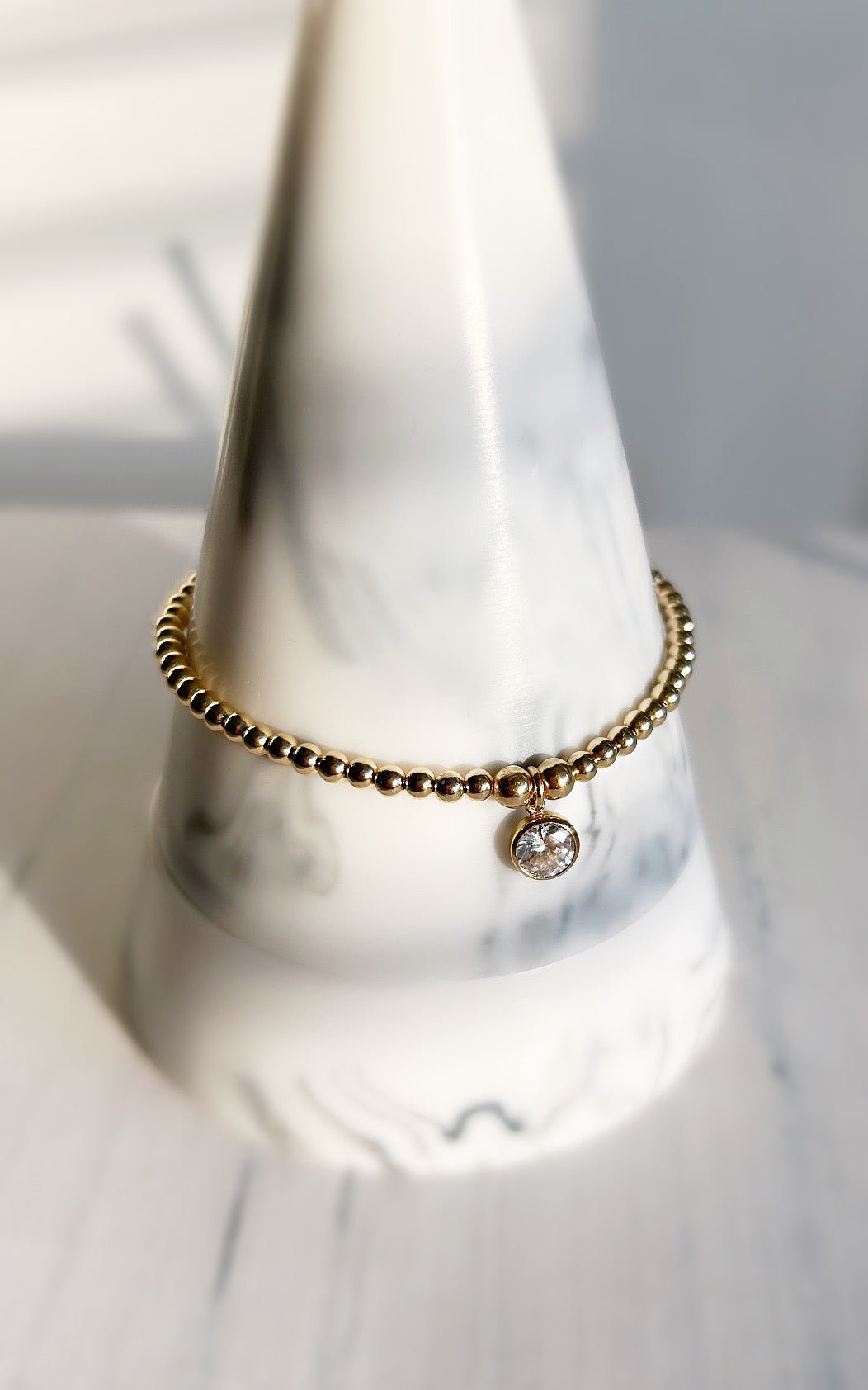 Beautiful crystal gemstone bracelets, perfect for stacking! Choose from either - Sterling Silver or a Gold Filled finish with a sparkling Cubic Zirconia charm.