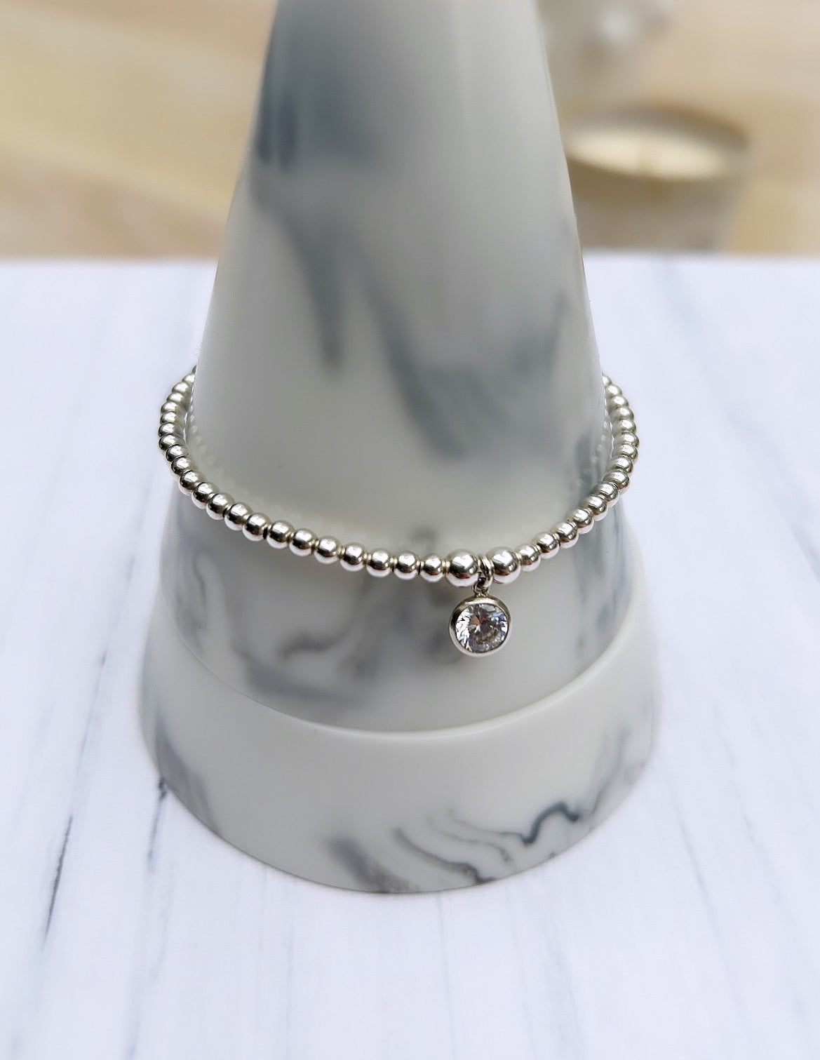 Beautiful crystal gemstone bracelets, perfect for stacking! Choose from either - Sterling Silver or a Gold Filled finish with a sparkling Cubic Zirconia charm.