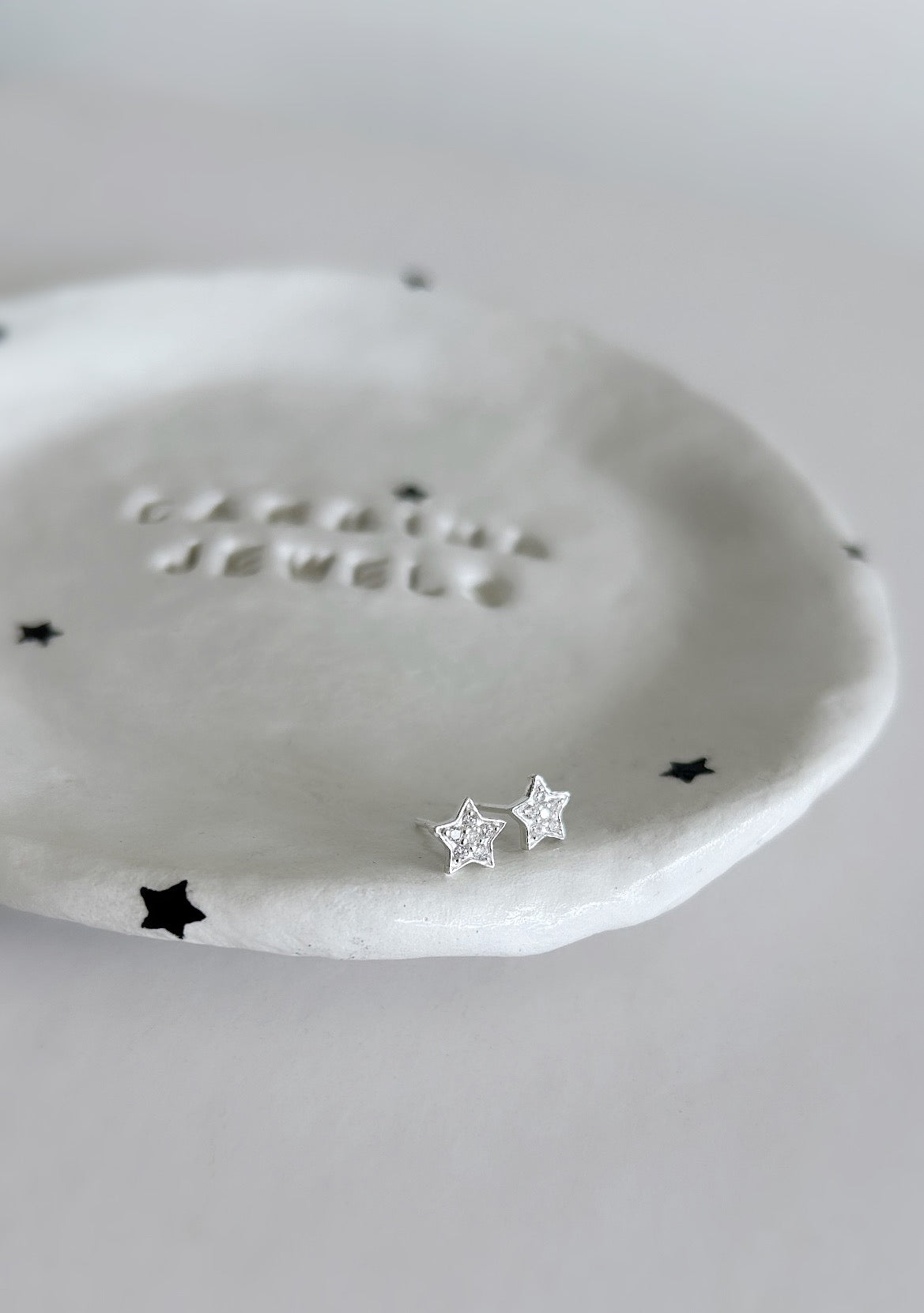 Sterling Silver Star ear studs encrusted with Cubic Zirconia crystals, which sparkle beautifully in the light.