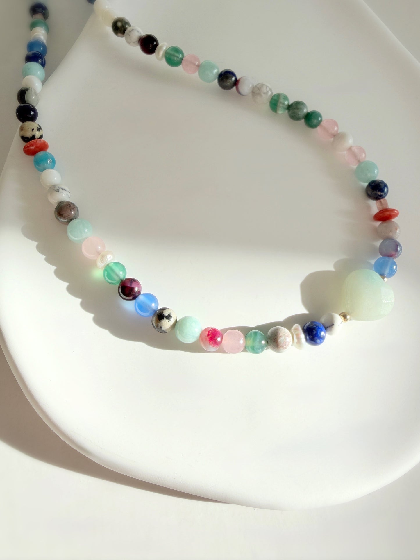 This delicious ‘Sweetie’ necklace features Semi precious beads in a glorious mix of colours, with a choice of a central Amazonite heart bead or baroque Freshwater Pearl.