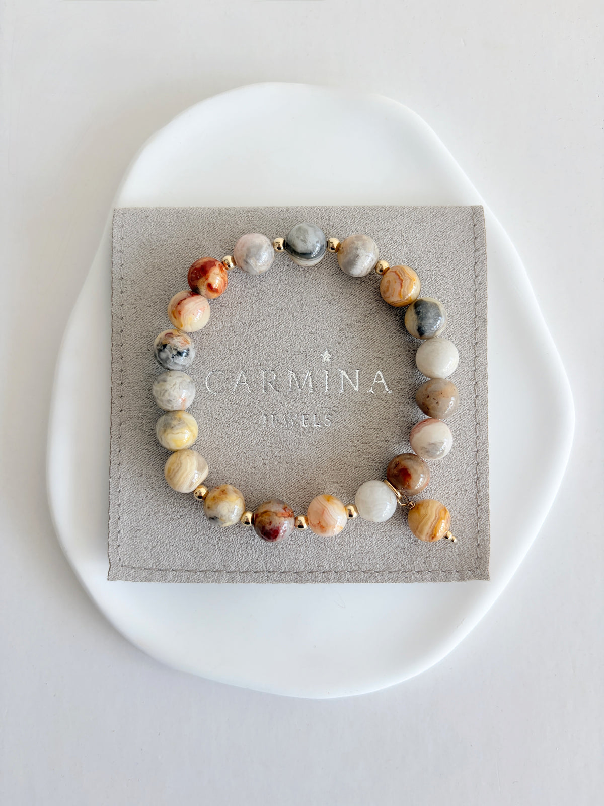 A beautiful grey/beige Crazy lace Agate beaded bracelet accented with Miyuki seed beads in your choice of Gold Filled or Sterling Silver. The 8mm beads are the perfect size to complement your stacks of smaller bracelets and bangles.

