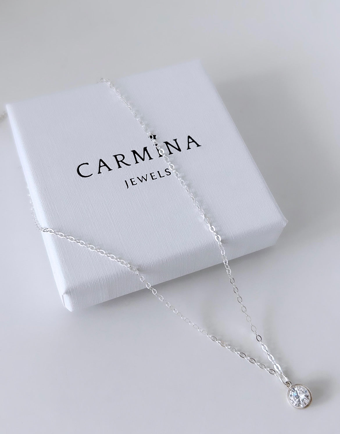 A beautiful crystal gemstone necklace - a gorgeous sparkly Cubic Zirconia charm on a delicate cable chain. 