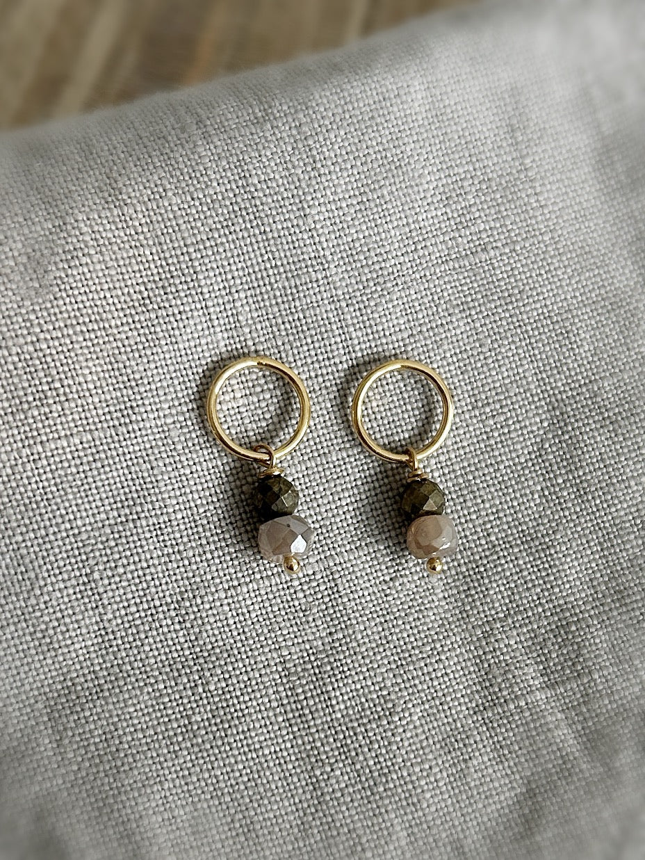 Pair of gold open circle studsearrings with crystal beads 