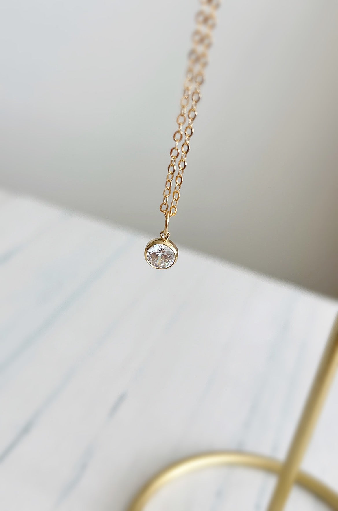 A beautiful crystal gemstone necklace - a gorgeous sparkly Cubic Zirconia charm on a delicate cable chain. 