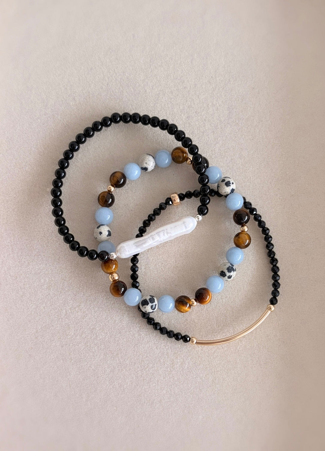 A gorgeous semi precious mixed bead bracelet incorporating Angelite, Tigers Eye and Dalmatian Jasper beads.  