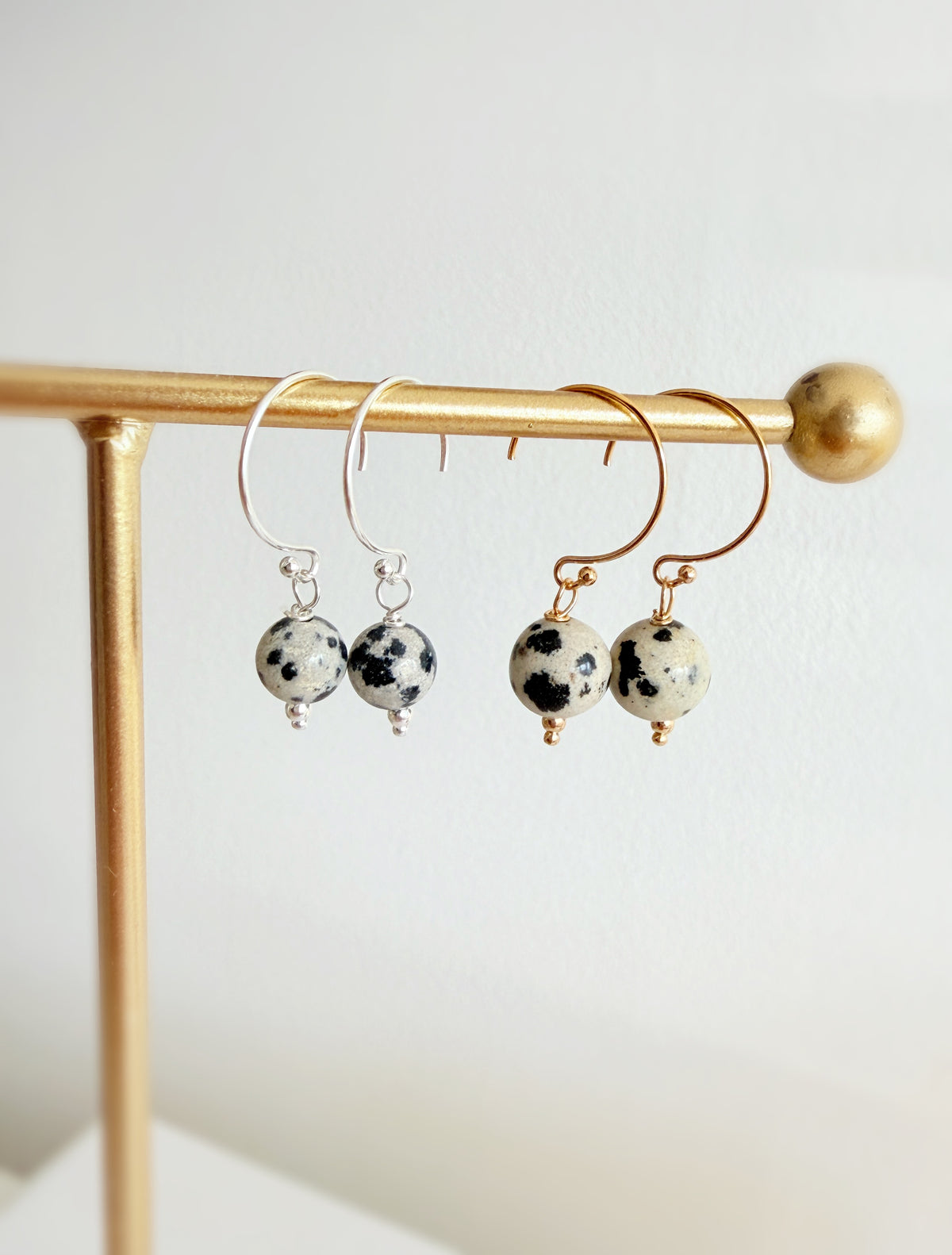 Semi precious Dalmatian Jasper bead earrings on a circle wire pierced ear fitting finished in either a Sterling Silver or Gold filled finish. 
