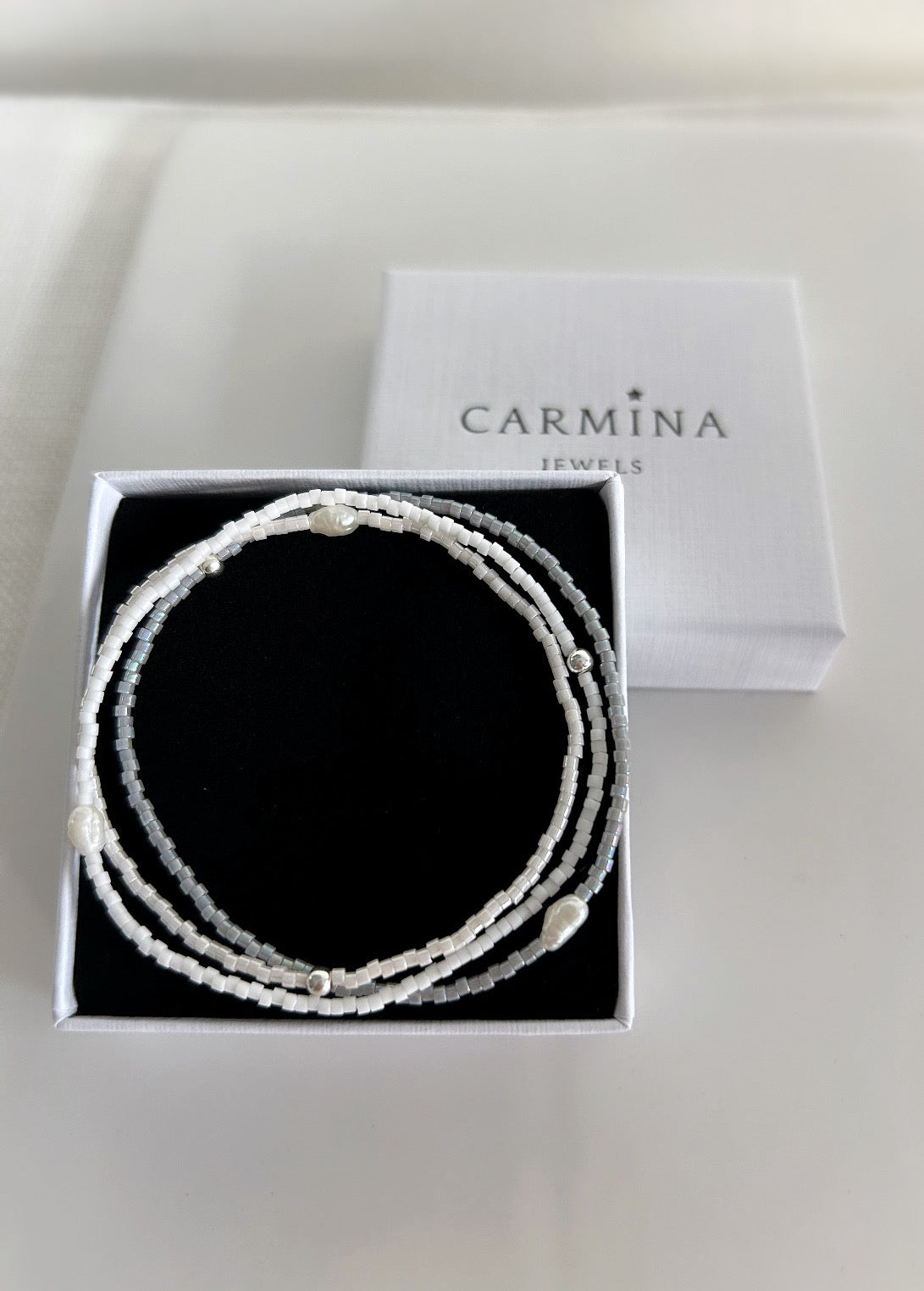 Delicate Miyuki glass beaded bracelets, in a choice of Pearlescent white, grey or matte white, with a beautiful Freshwater rice Pearl. 

These dainty mini bracelets are perfect little stackers! 