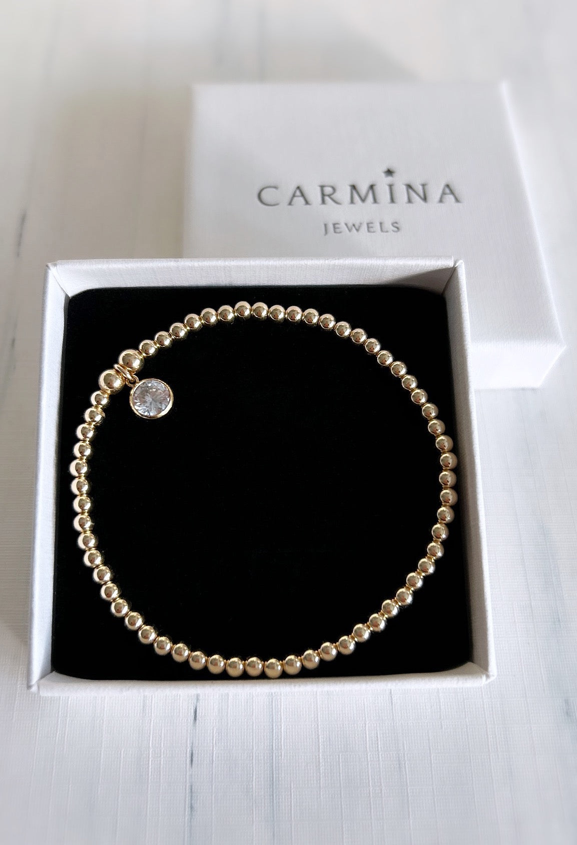 Beautiful crystal gemstone bracelets, perfect for stacking! Choose from either - Sterling Silver or a Gold Filled finish with a sparkling Cubic Zirconia charm.