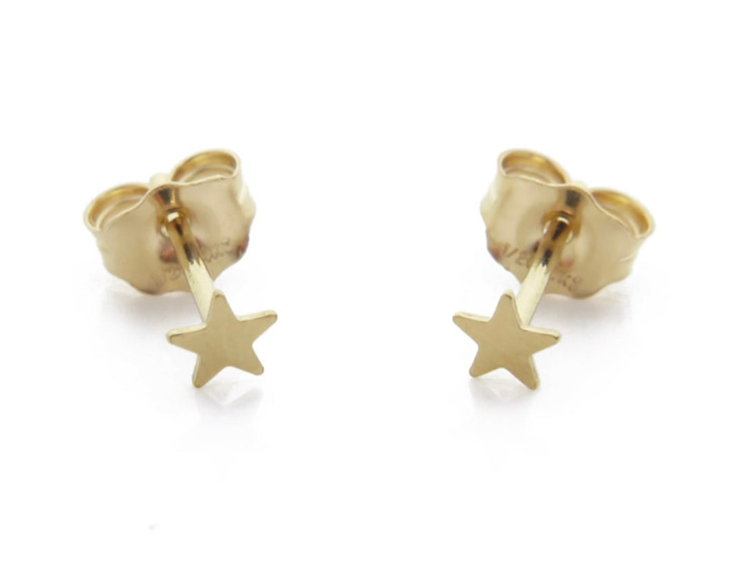 A pair of gold-filled star stud earrings with butterfly fasteners, designed for piercings or earlobe/helix stack.