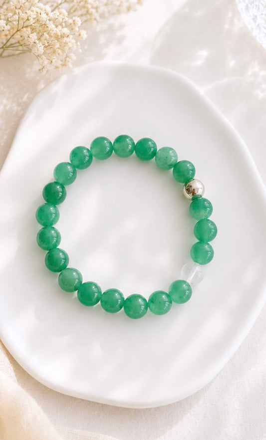 A beautiful Summer vibe semi precious beaded stacking bracelet with a Silver or Gold accent bead and clear quartz bead. Hand threaded on a strong elastic cord. 