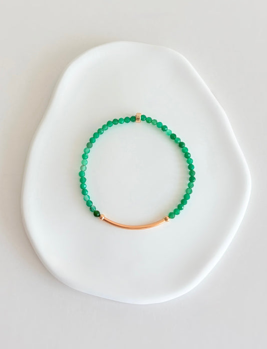 Beautiful Green onyx semi precious faceted bead bracelet hand threaded on a strong stretch elastic cord. This delicate bracelet comes in a choice of two finishes using either Sterling Silver or Gold Filled accents.