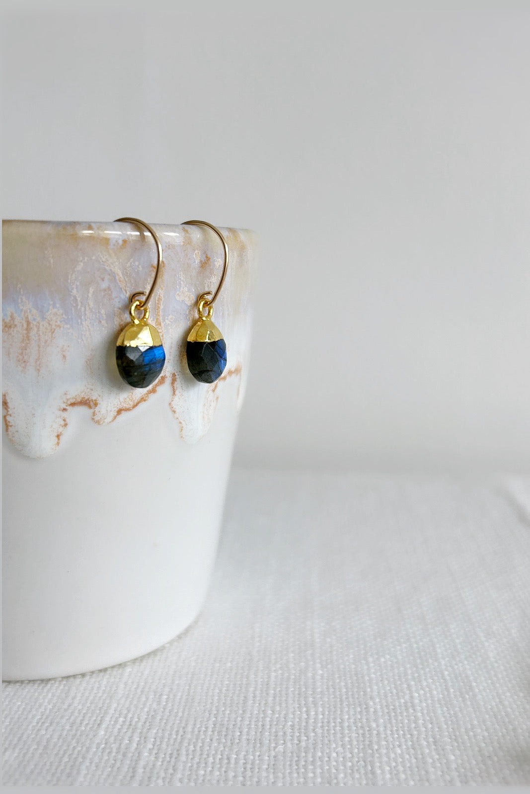Labradorite gemstone droplet earrings in gold or silver on a curved hook