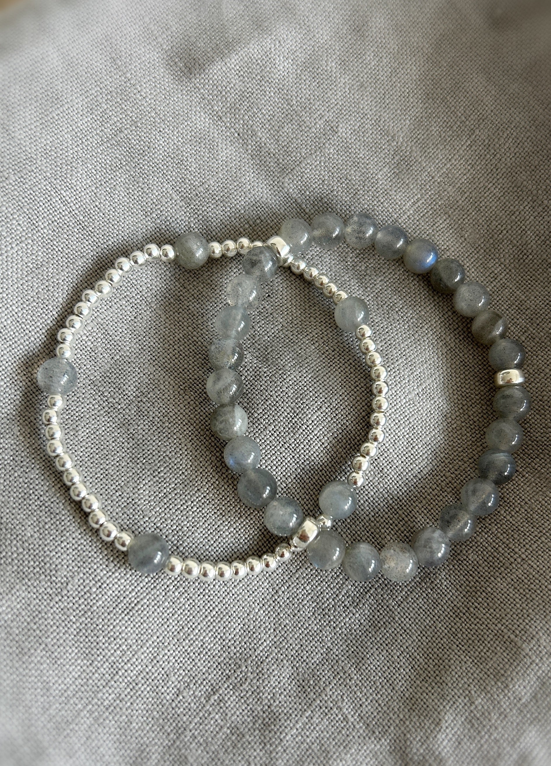 A handcrafted stacking bracelet featuring semi-precious Labradorite beads, accented with Sterling Silver or Gold Filled spacer beads strung on a durable stretch cord.
