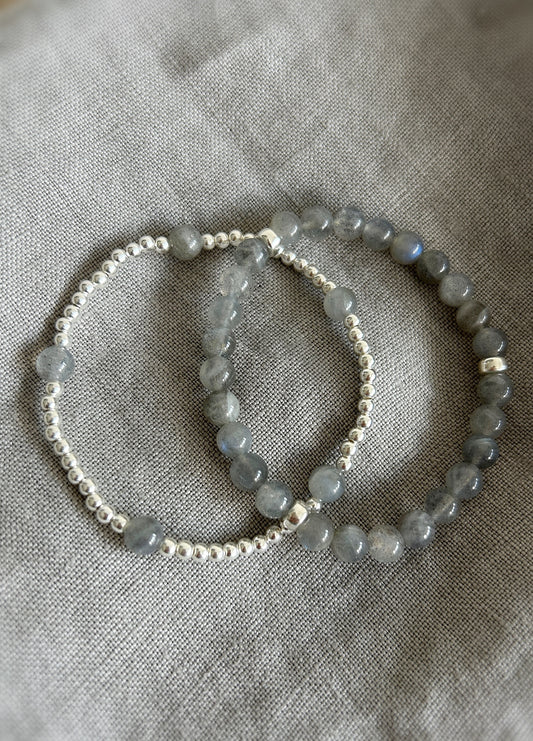 A handcrafted stacking bracelet featuring semi-precious Labradorite beads, accented with Sterling Silver or Gold Filled spacer beads strung on a durable stretch cord.
