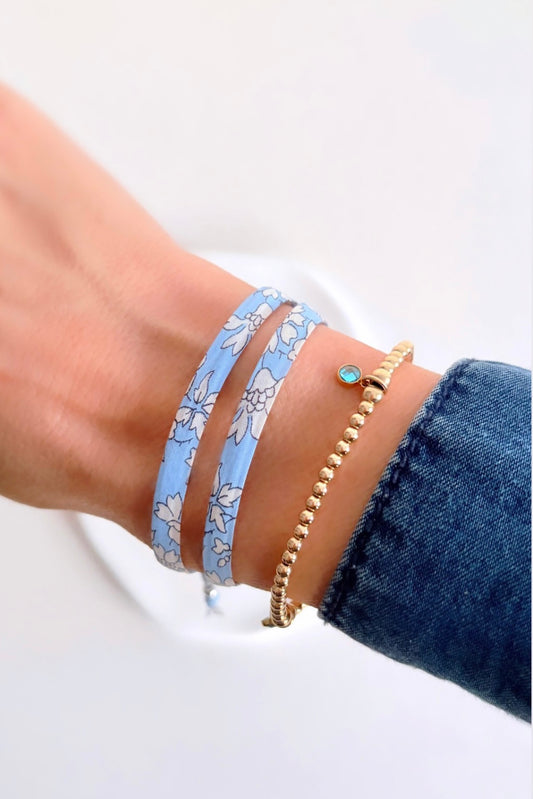 Liberty of London fabric wrap bracelets, with a Sterling Silver textured slide bead. Choose from ‘Capel’ Violet or Pale Blue, ‘Betsy fluo’, or ‘Millie’ cassis - and not forgetting Pheobe, Wiltshire and Mitsi!
