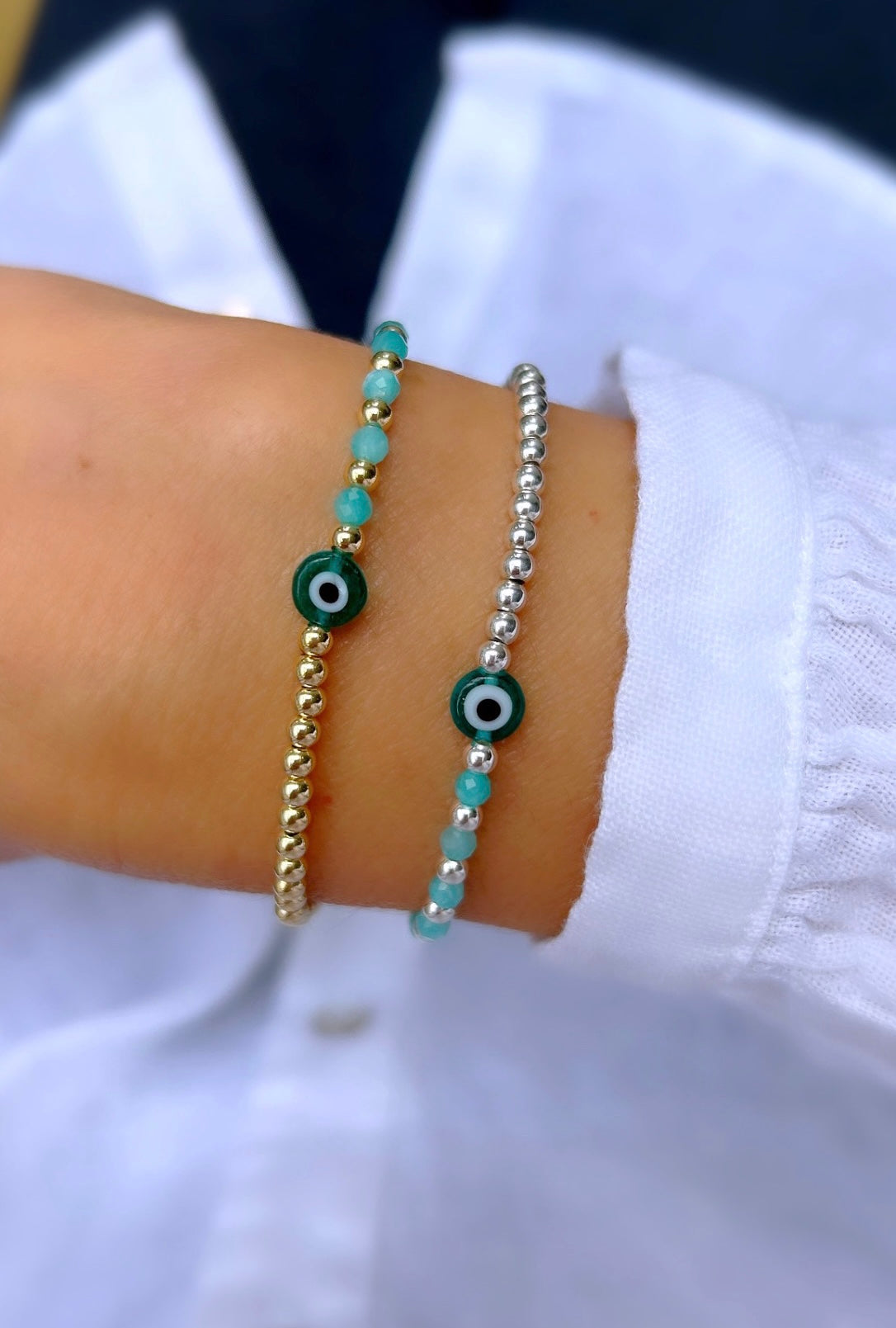 a gold filled or sterling silver bracelet, each featuring a Murano glass lucky 'evil' eye charm and Amazonite glass crystal beads.