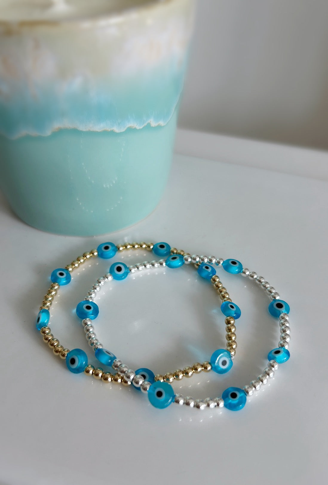 Pretty handmade Murano glass lucky ‘evil’ eye charm bracelet in a Sterling Silver or Gold Filled finish. Choose from either blue or turquoise glass ‘eye’ beads. 