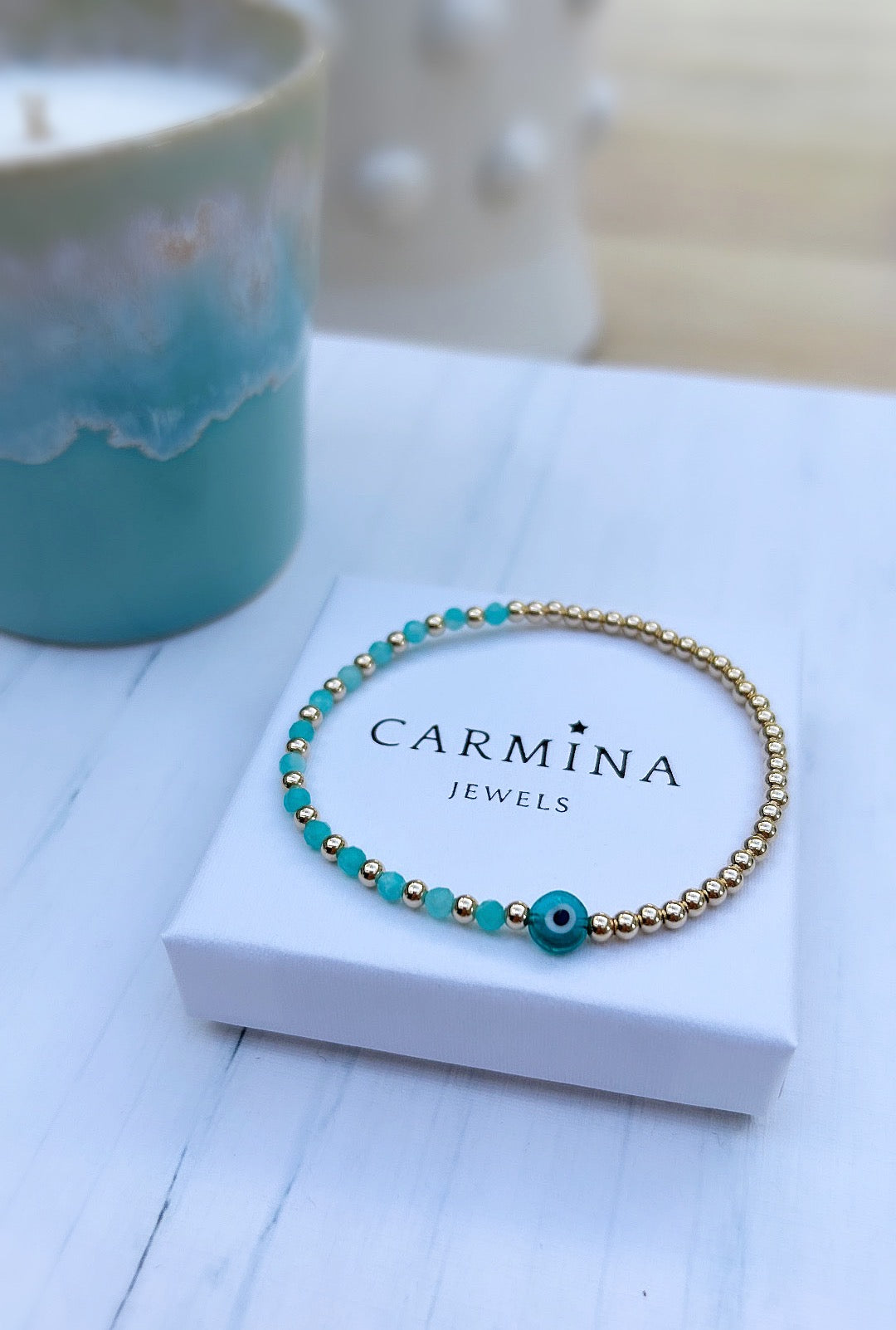 Pretty handmade Murano glass lucky ‘evil’ eye charm bracelet with Amazonite glass crystal beads, either in a Sterling Silver or Gold Filled finish. The bracelets are hand threaded on a high quality stretch cord.