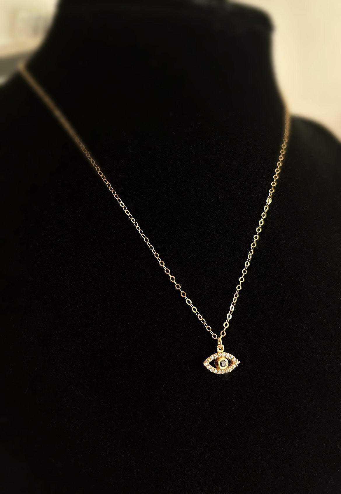 A gorgeous pendant on a delicate cable chain with a lucky ‘Evil Eye’ charm set with cubic zirconia. Available in either a Sterling Silver or Gold finish. 
