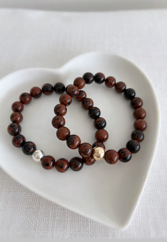 Mahogany obsidian semi precious bead bracelet on a stretch cord with a single gold filled or Sterling Silver bead 