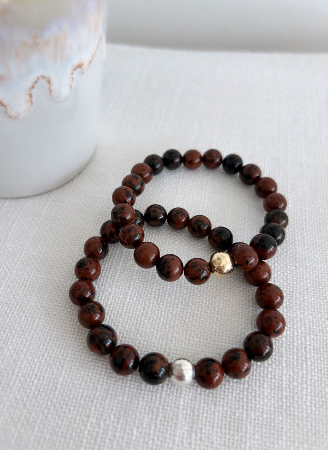 A stunning, richly coloured Golden Obsidian beaded bracelet featuring a central round bead in your choice of Gold Filled or Sterling Silver