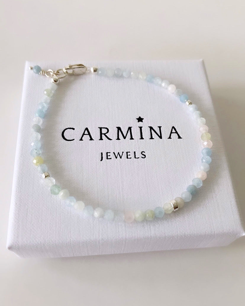 A Morganite crystal bracelet featuring faceted beads and a silver or gold filled closure.