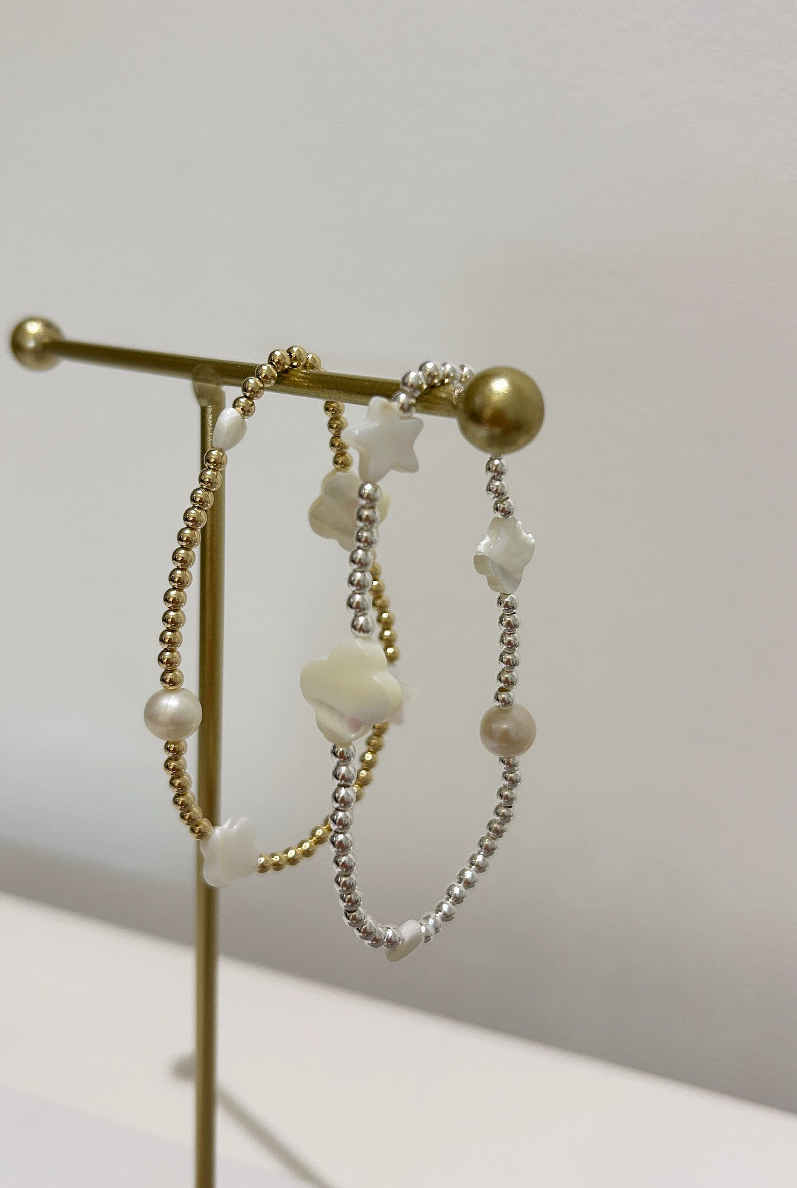 This beautiful stacking bracelet is adorned with a charming mix of hearts, stars, and pearls and clovers ~ featuring a freshwater pearl, a Mother of Pearl heart, star and clovers. 