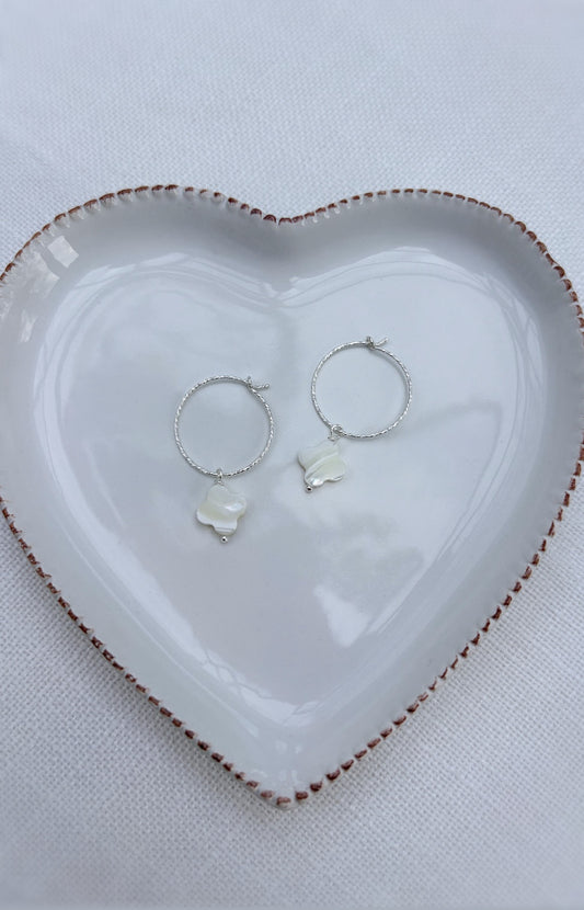 Gorgeous sparkle hoop earrings with Mother of Pearl clover charms. Available in either a Sterling Silver or Gold Filled finish. 
