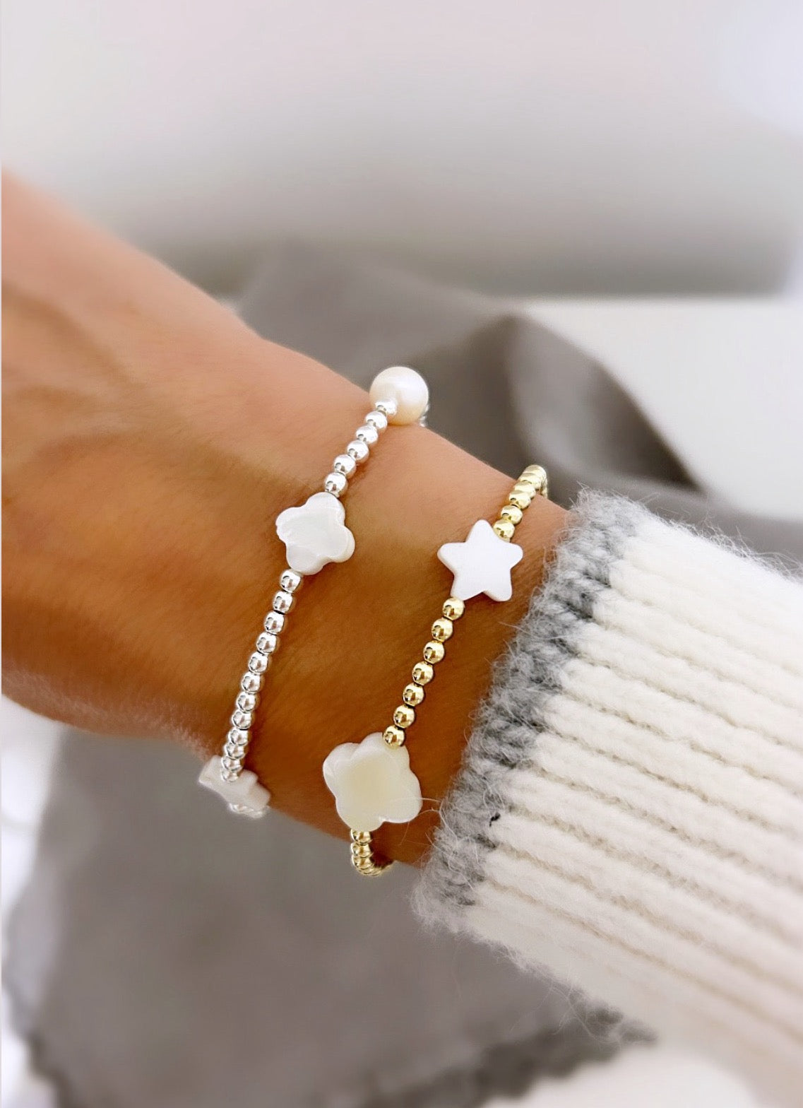This beautiful stacking bracelet is adorned with a charming mix of hearts, stars, and pearls and clovers ~ featuring a freshwater pearl, a Mother of Pearl heart, star and clovers. 