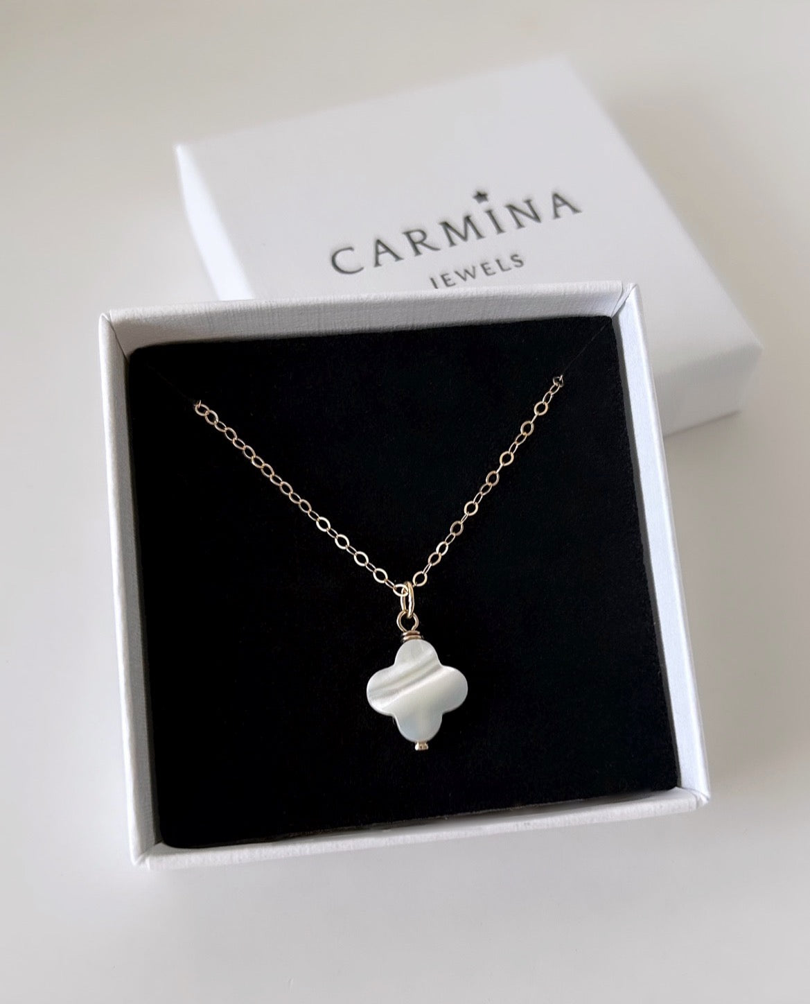Beautiful Mother of Pearl clover shaped pendant - on a delicate 16” cable chain in either Sterling Silver or Gold Filled.
