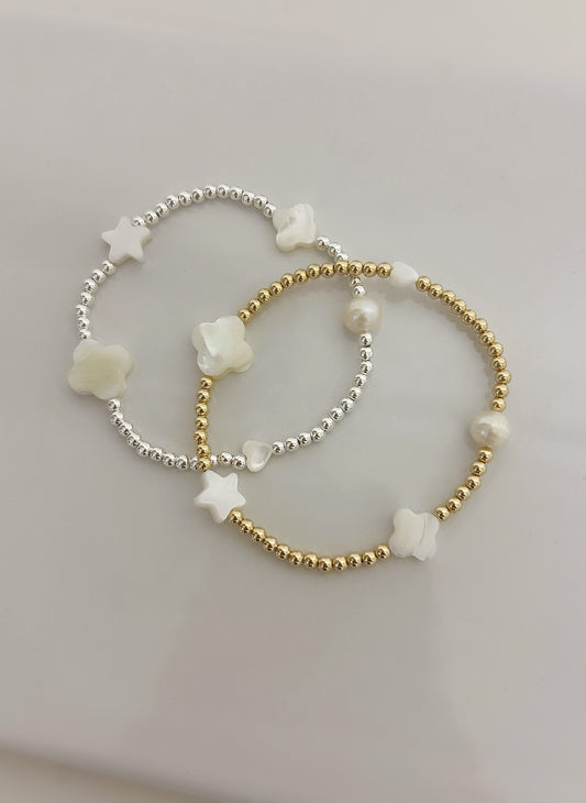 This beautiful stacking bracelet is adorned with a charming mix of hearts, stars, and pearls and clovers ~ featuring a freshwater pearl, a Mother of Pearl heart, star and clovers