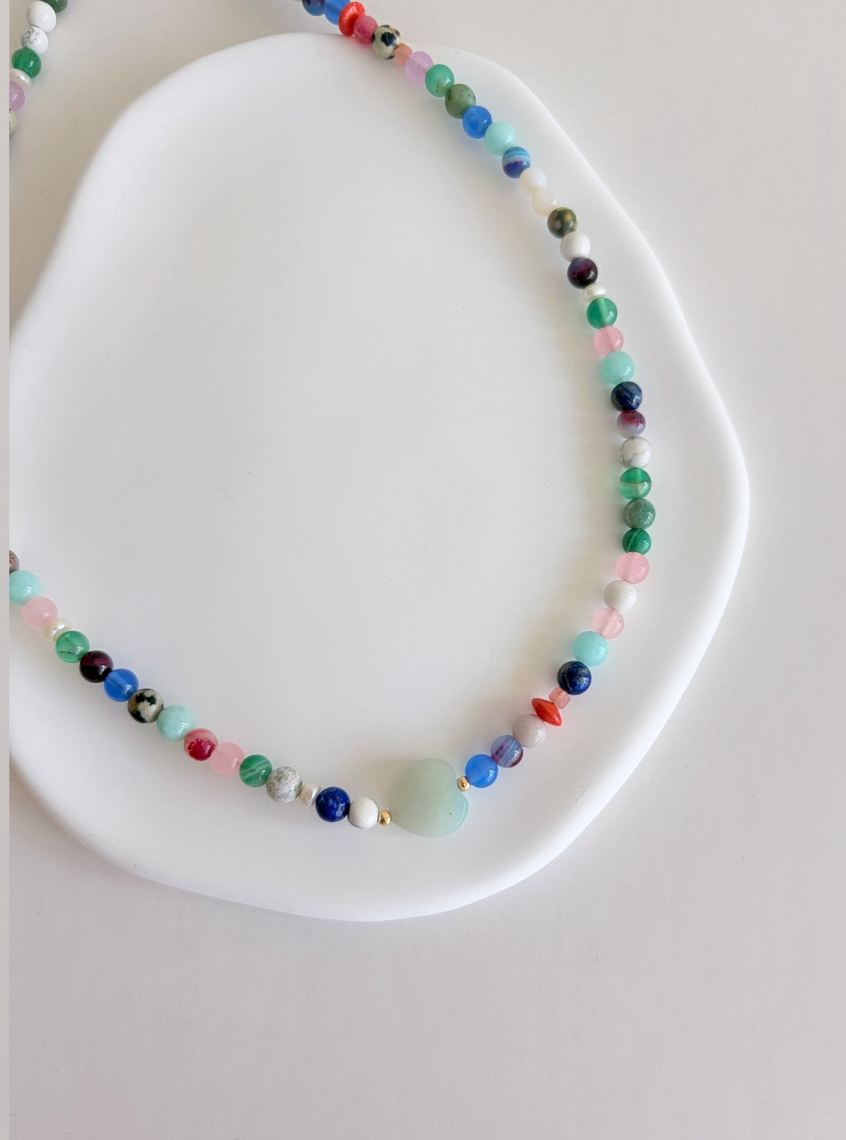This delicious ‘Sweetie’ necklace features Semi precious beads in a glorious mix of colours, with a choice of a central Amazonite heart bead or baroque Freshwater Pearl.