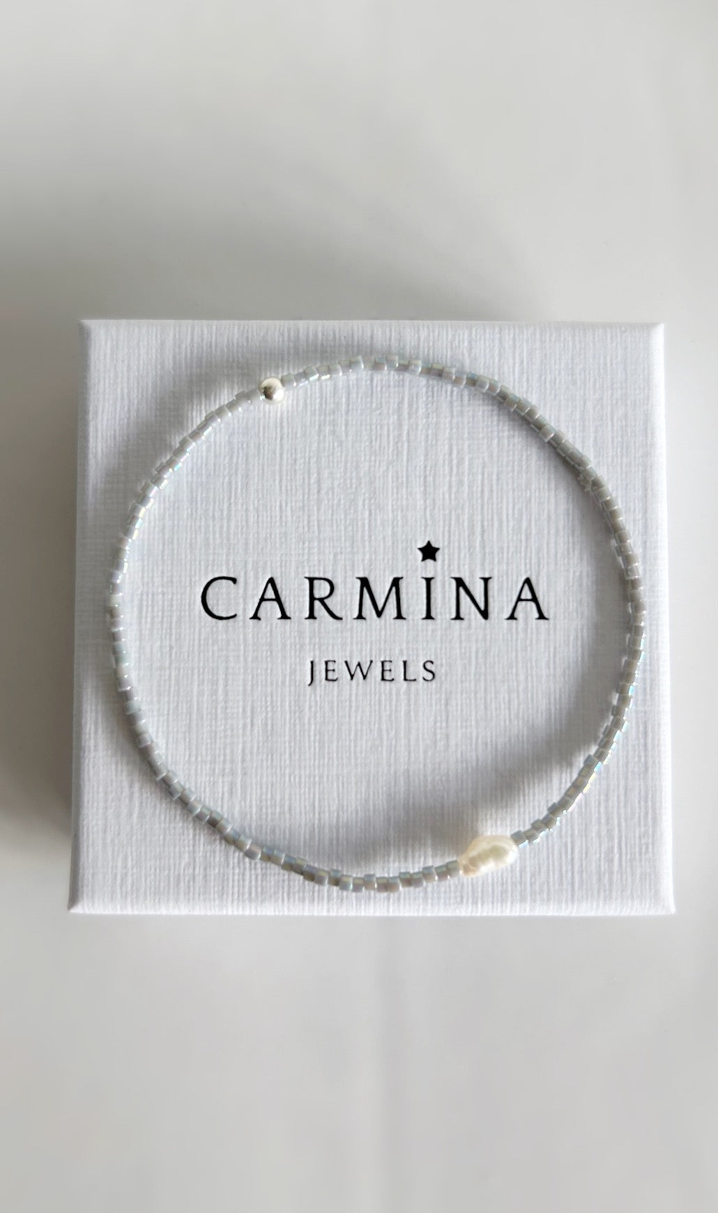 Delicate Miyuki glass beaded bracelets, in a choice of Pearlescent white, grey or matte white, with a beautiful Freshwater rice Pearl. 

These dainty mini bracelets are perfect little stackers! 