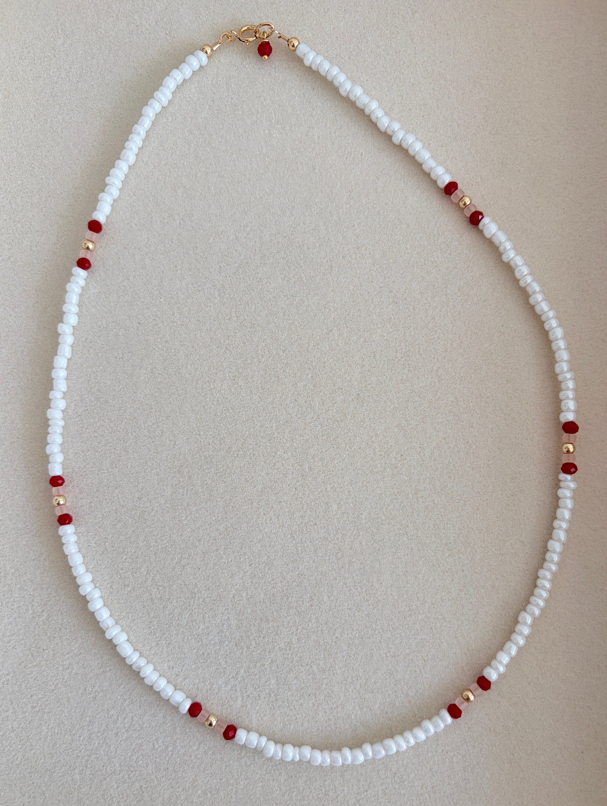 Pretty lustred glass seed bead Necklace, mixed with a subtle pattern of either aqua & pale grey or red/pink crystal glass beads and gold/silver spacer beads. The necklace will be finished with a Gold Filled or Sterling Silver fastening lobster clasp. A perfect necklace for layering with other chains or pendants.
