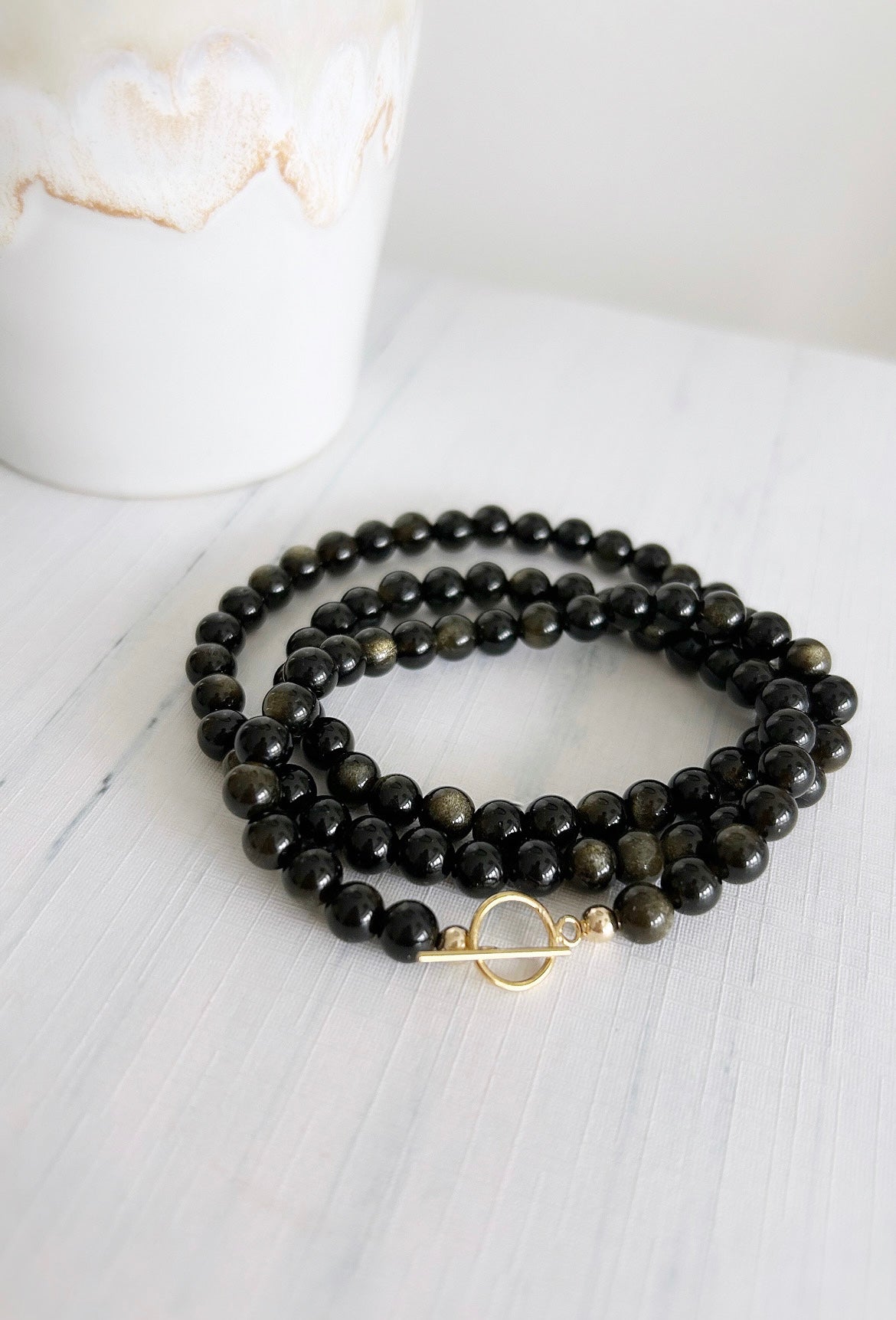 A gorgeous ‘2 in 1’ Semi Precious beaded wrap bracelet &/or necklace in a choice of either beautiful Smoky Quartz, Lapis Lazuli, Labradorite or Golden Obsidian. Finished with a delicate toggle clasp in Gold filled or Sterling Silver.