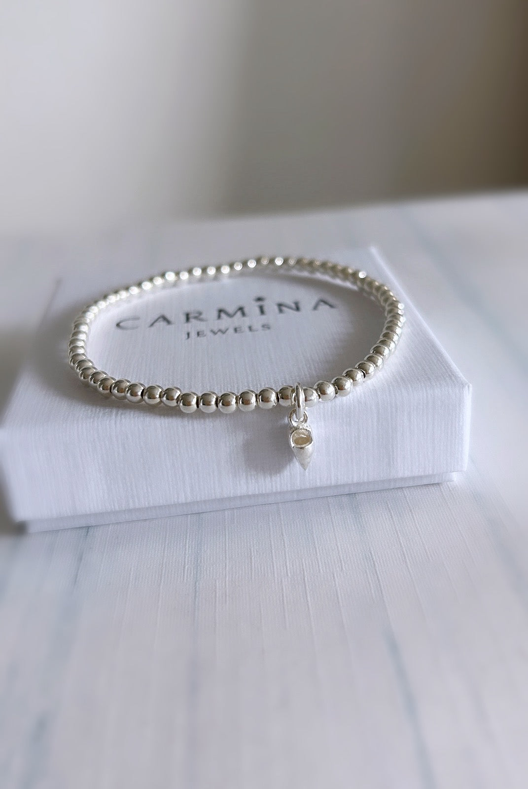 Silver beard bracelet with a small shankha shell pendant