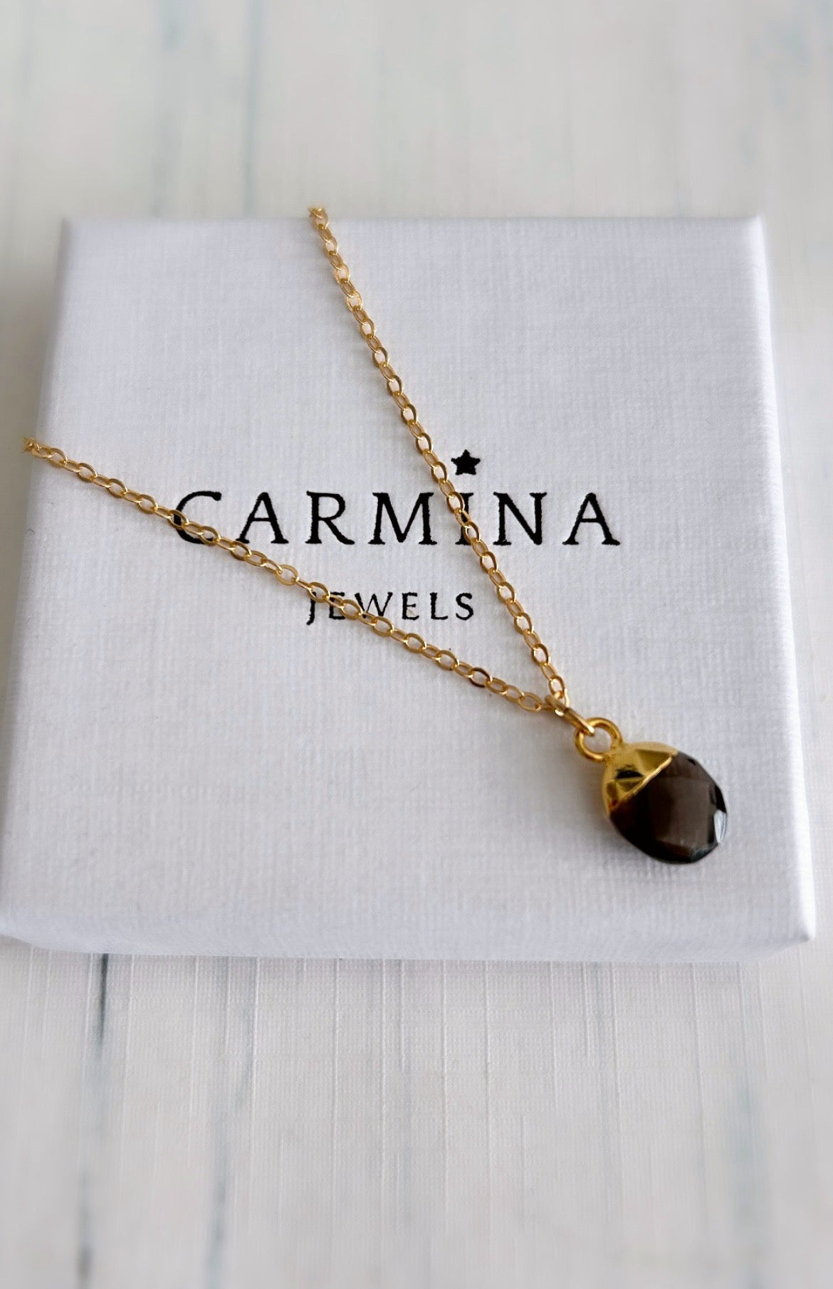 A gorgeous chocolate coloured Smoky Quartz gemstone pendant on either a Sterling Silver or Gold finish on a 16” cable chain. 