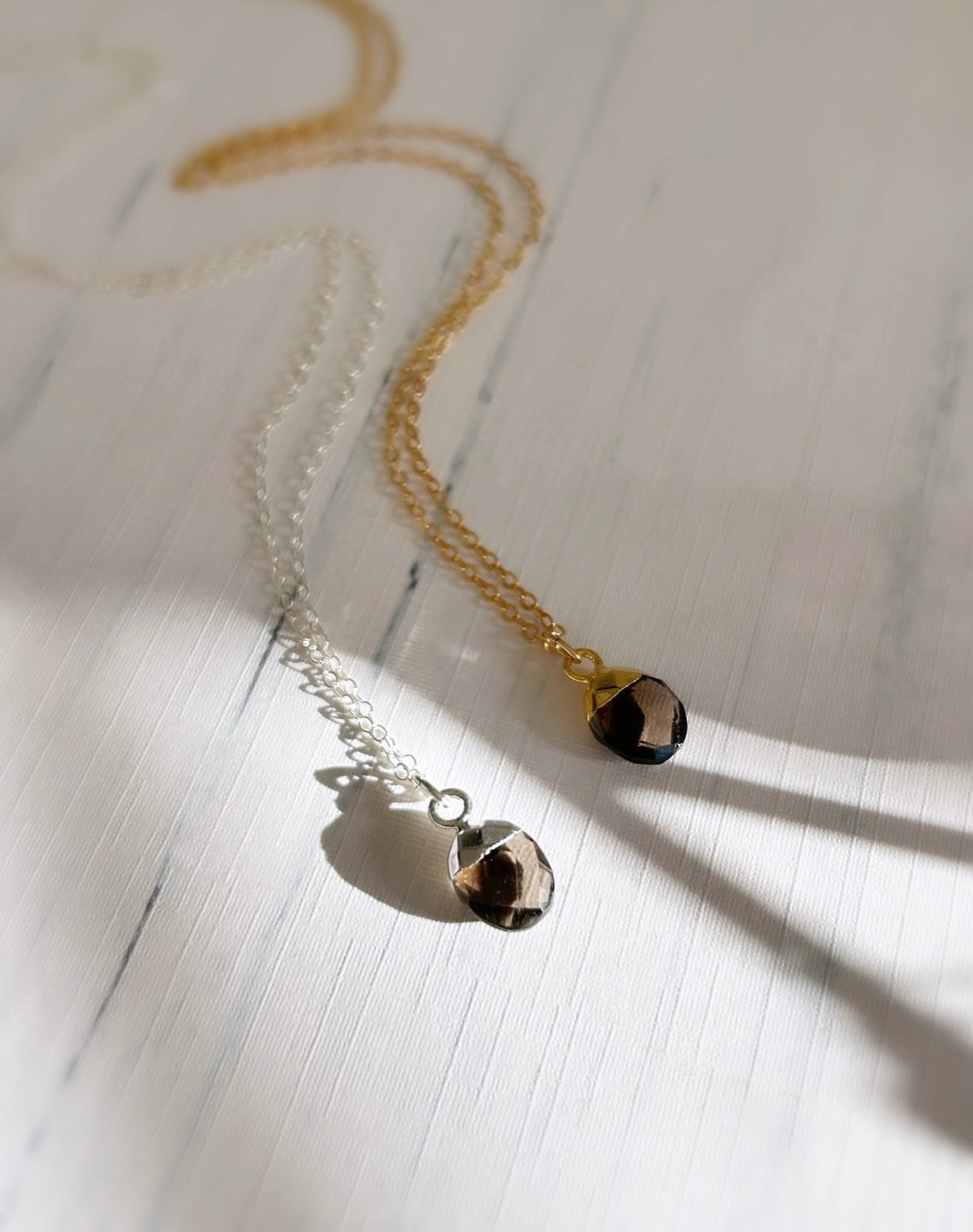 A gorgeous chocolate coloured Smoky Quartz gemstone pendant on either a Sterling Silver or Gold finish on a 16” cable chain. 