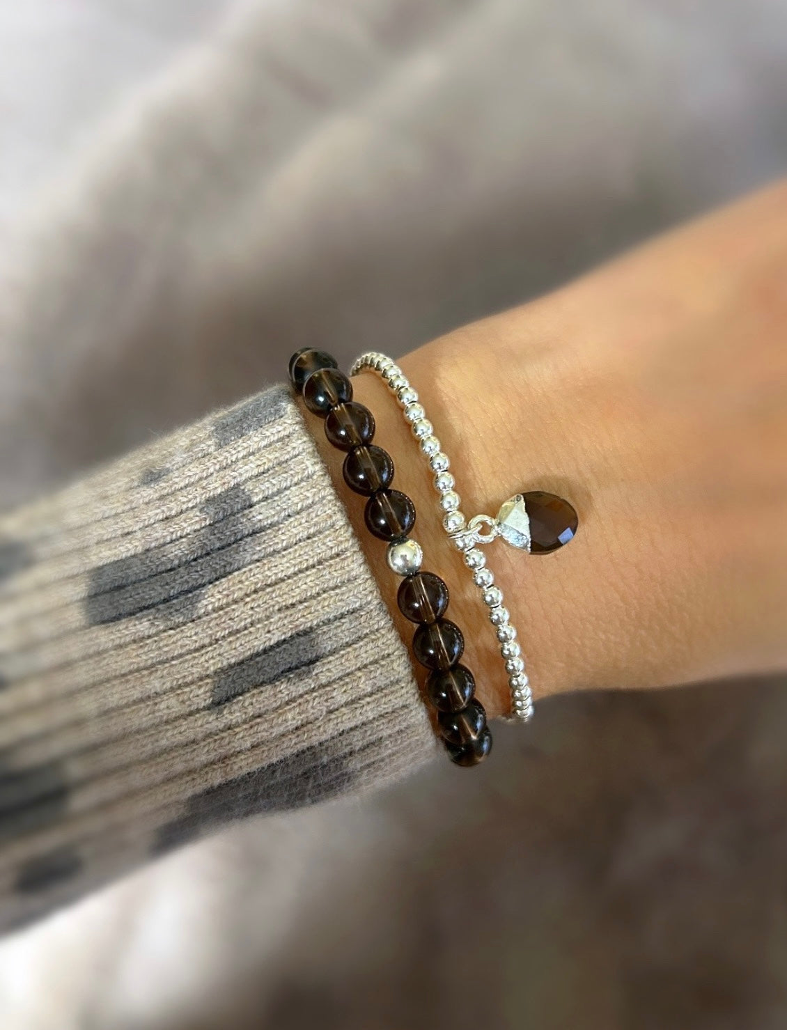 Gorgeous Smoky Quartz beaded bracelet with a Sterling Silver or Gold Filled spacer bead hand threaded on a stretch cord. 