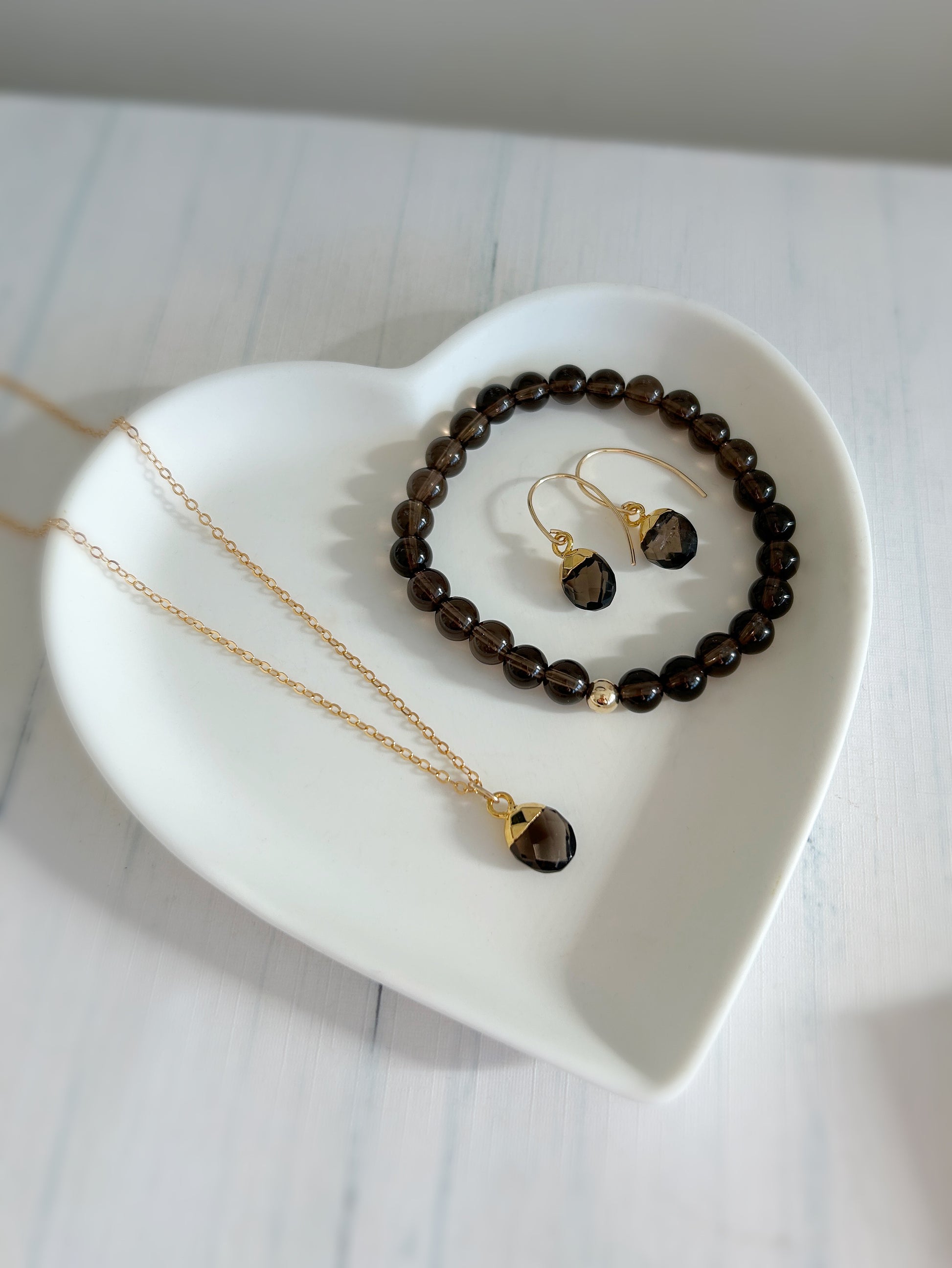 A gorgeous chocolate coloured Smoky Quartz gemstone pendant on either a Sterling Silver or Gold finish on a 16” cable chain. 