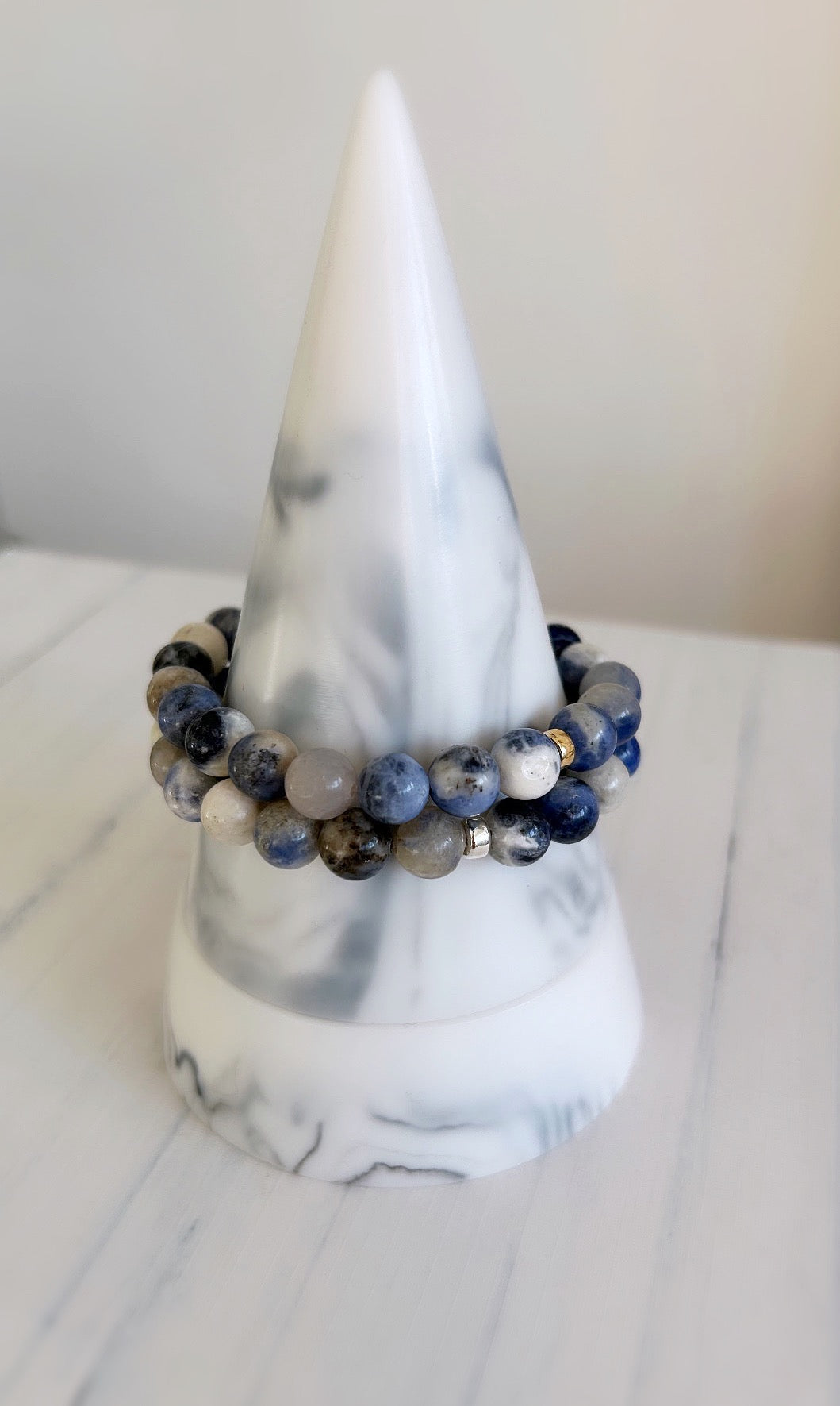 A sodalite bead bracelet featuring beaded sodalite gemstones with options of a sterling silver or gold filled 'finishing touch' spacer bead.