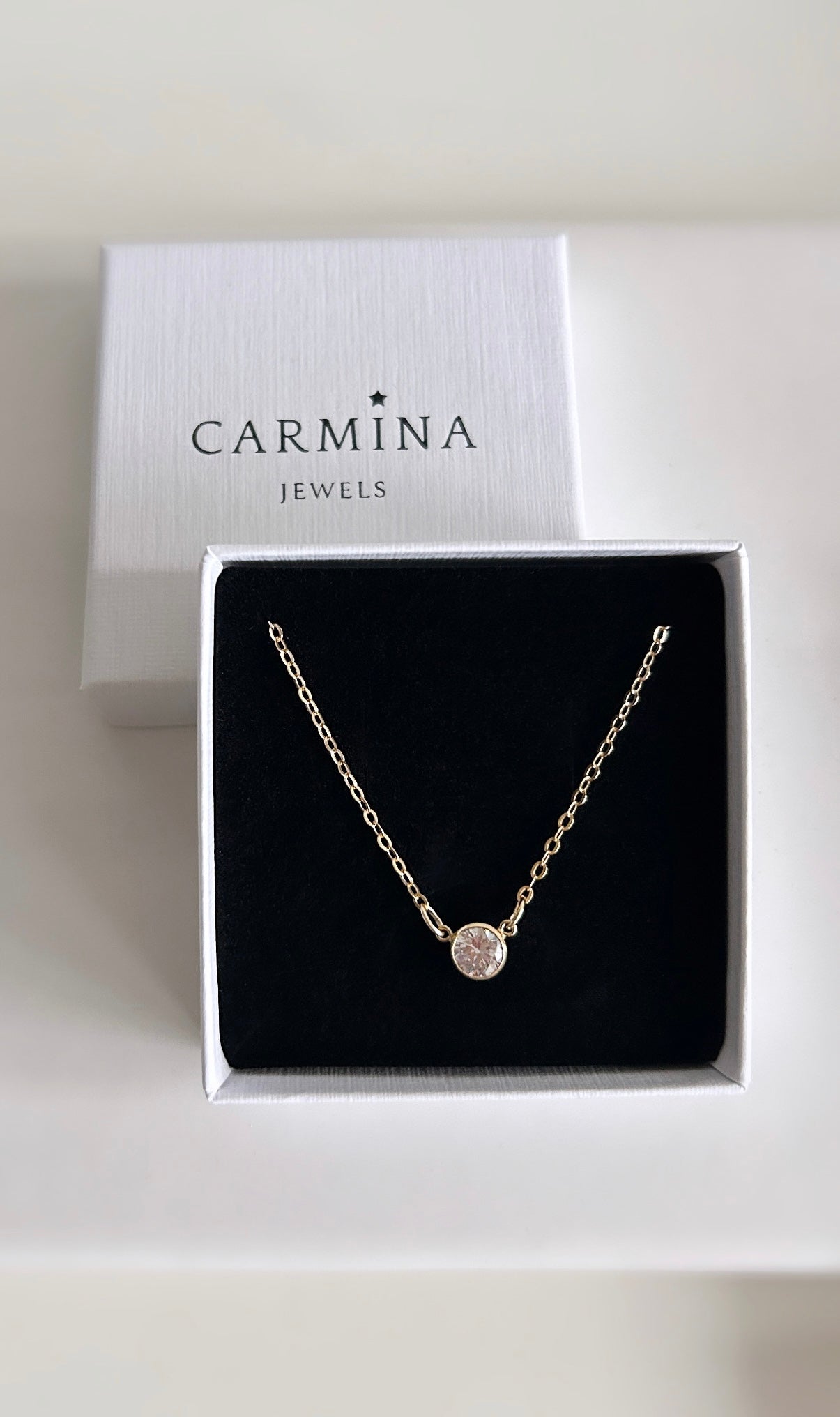 A super sparkly Cubic Zirconia choker style necklace on a 14” gold filled chain, with a 2” extender. The necklace sits just in the nape of the neck and is therefore a perfect necklace for layering up with longer chains.

The beautiful brilliant white CZ stone measures 9.5mm.